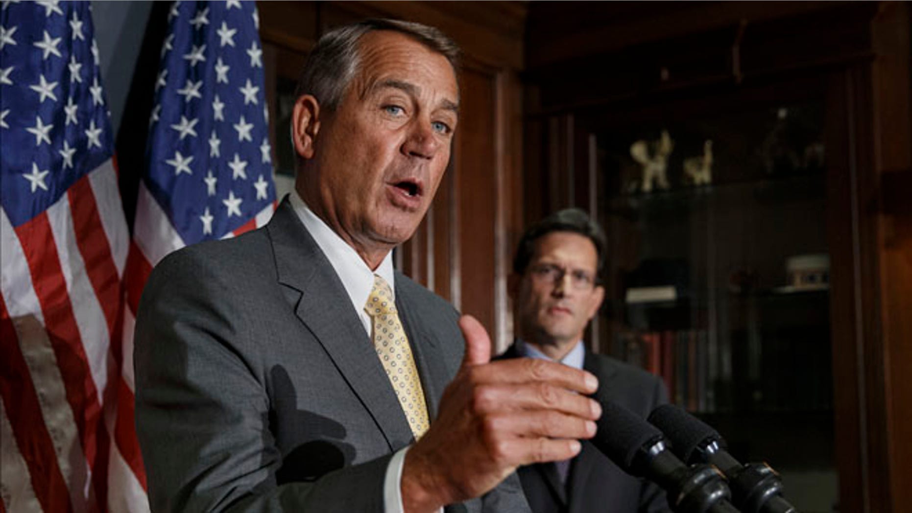 Jan. 28, 2014: House Speaker John Boehner, left, with House Majority Leader Eric Cantor, talks with reporters at Republican National Committee headquarters in Washington.