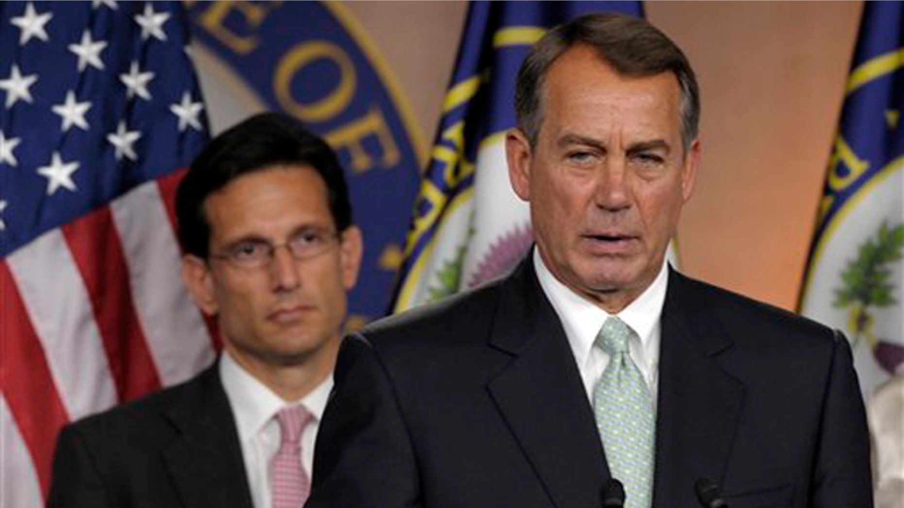 House Speaker John Boehner, right, speaks during a news conference with House Majority Leader Eric Cantor on Capitol Hill in Washington July 15.