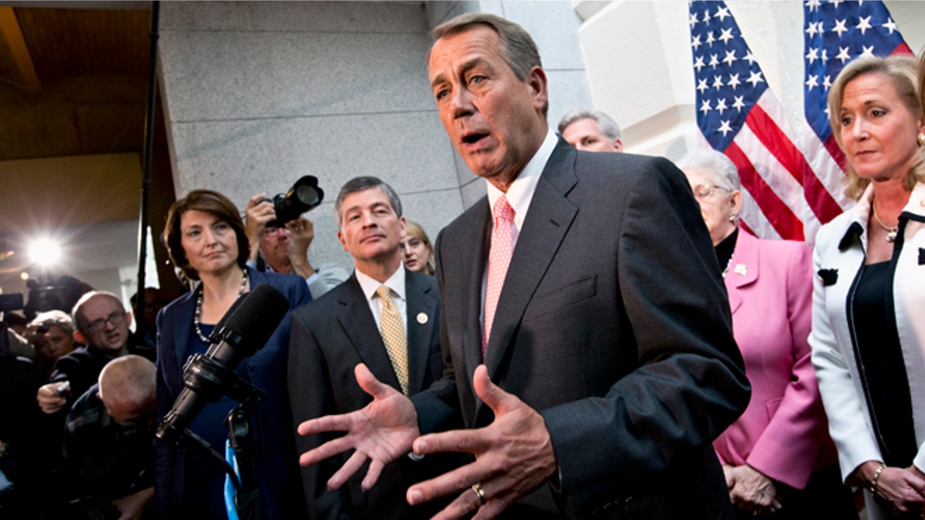 Oct. 10, 2013: House Speaker John Boehner, joined by fellow Republicans, speaks during a news conference on Capitol Hill in Washington.