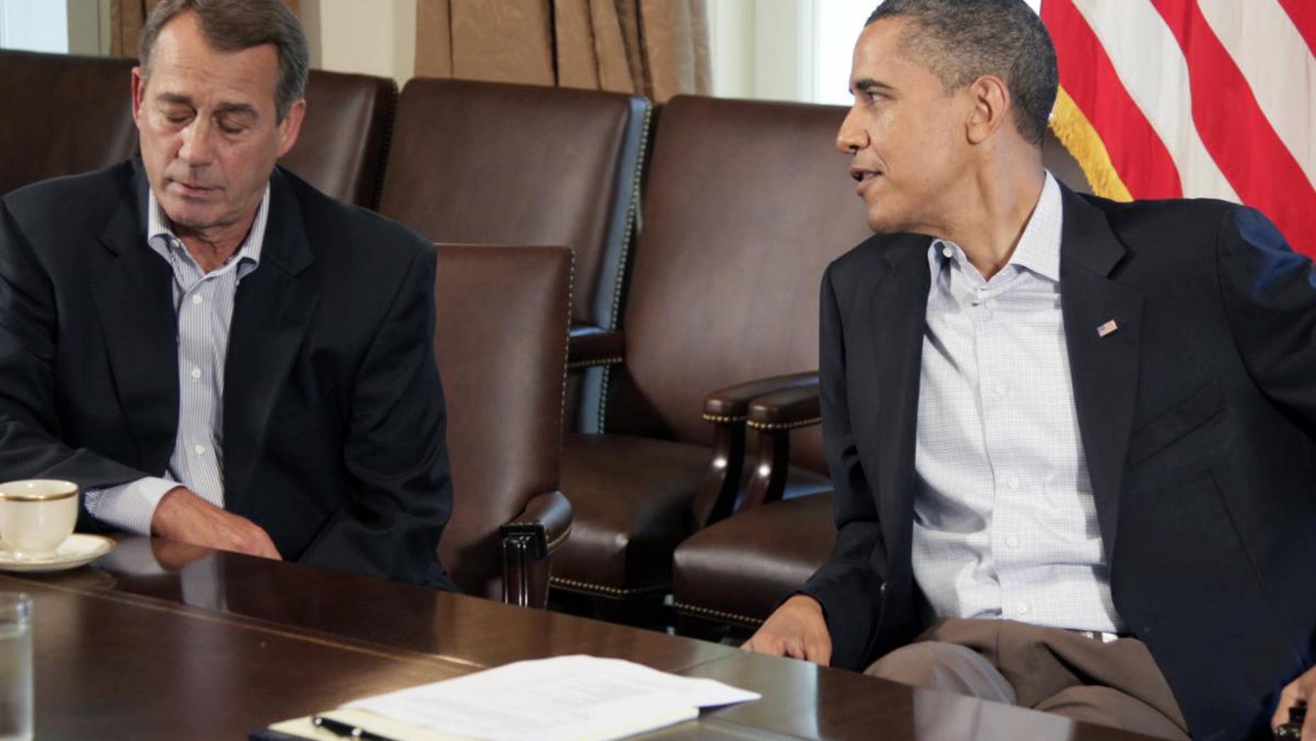 President Barack Obama meets with House Speaker John Boehner of Ohio, left, in the Cabinet Room of the White House, Saturday, July 23, 2011, in Washington, to discuss the debt. (AP Photo/Carolyn Kaster)