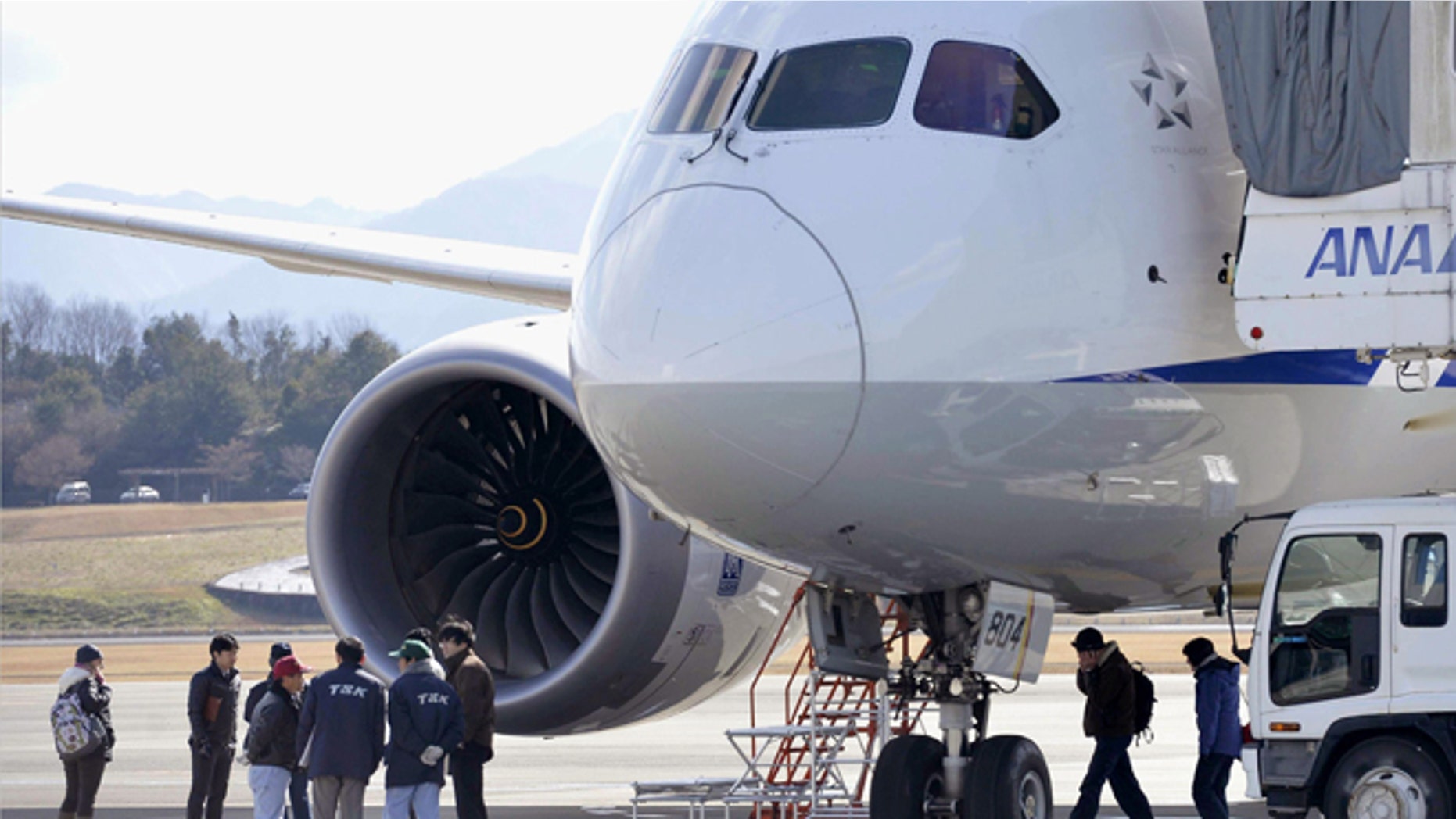 Jan. 18, 2013: In this file photo, officials inspect an All Nippon Airways Boeing 787 which made an emergency landing at Takamatsu airport in Takamatsu, western Japan.