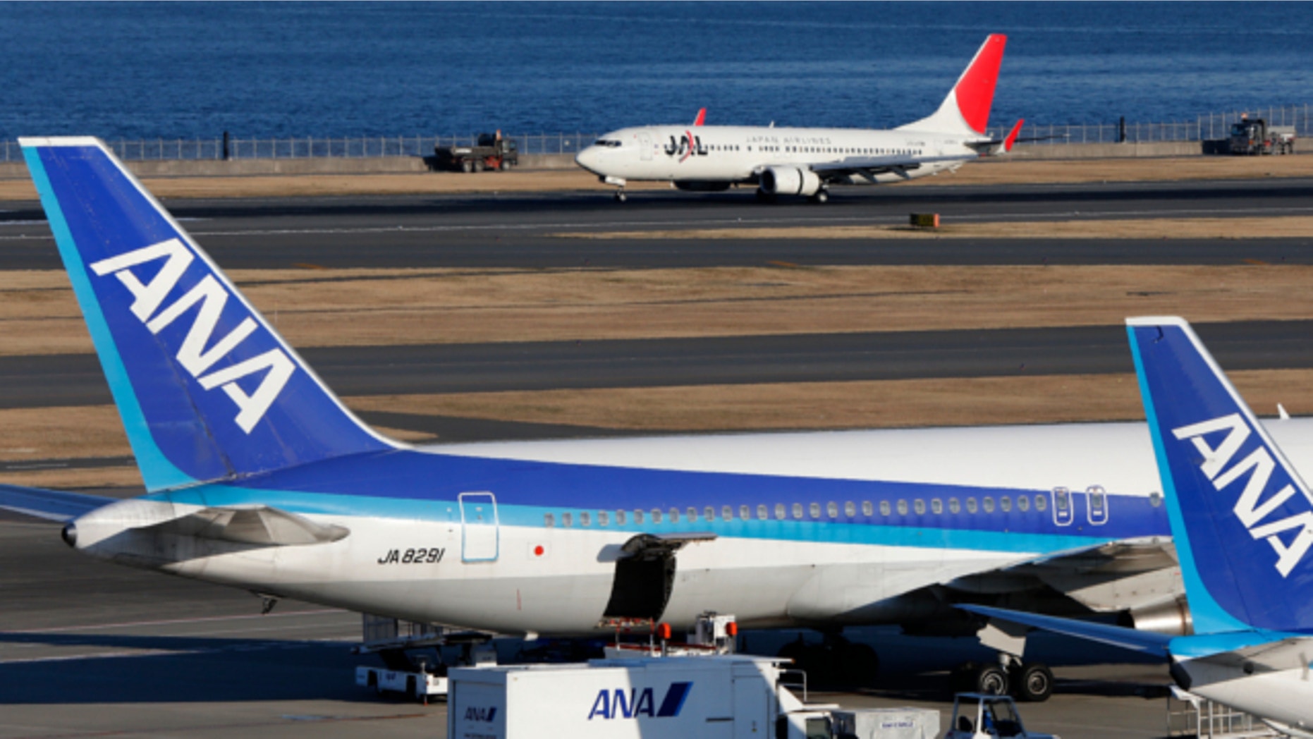 Jan. 30, 2013: All Nippon Airways passenger planes park on the tarmac of Haneda Airport in Tokyo.