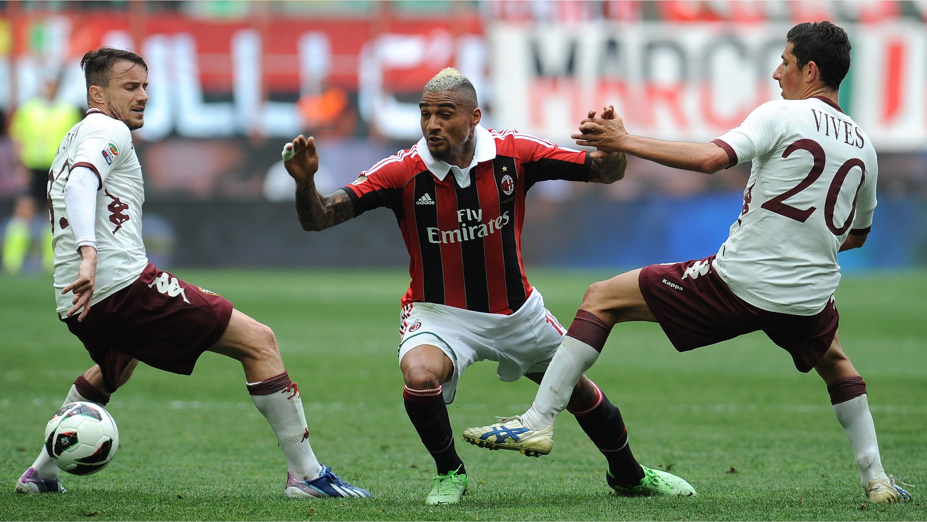 MILAN, ITALY - MAY 05: Kevin-Prince Boateng (C) of AC Milan in action against Giuseppe Vives (R) and Matteo Brighi of Torino FC during the Serie A match between AC Milan and Torino FC at San Siro Stadium on May 5, 2013 in Milan, Italy. (Photo by Valerio Pennicino/Getty Images)