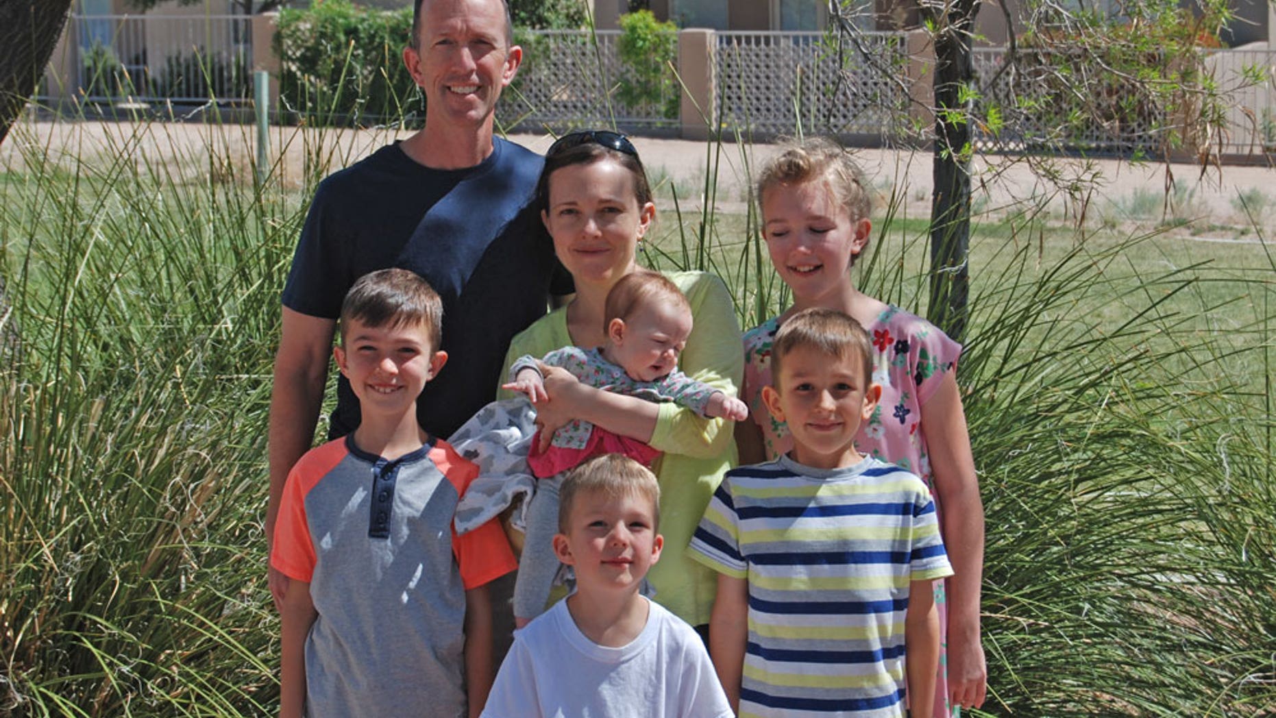 Col. Leland Bohannon, seen here with his family, was suspended from command over his views, according to his attorney.