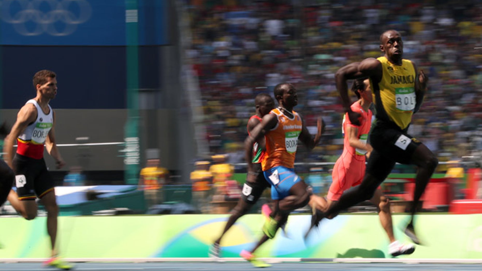 Jamaica's Usain Bolt, right, competes in a men's 200-meter heat during the athletics competitions of the 2016 Summer Olympics at the Olympic stadium in Rio de Janeiro, Brazil, Tuesday, Aug. 16, 2016.
