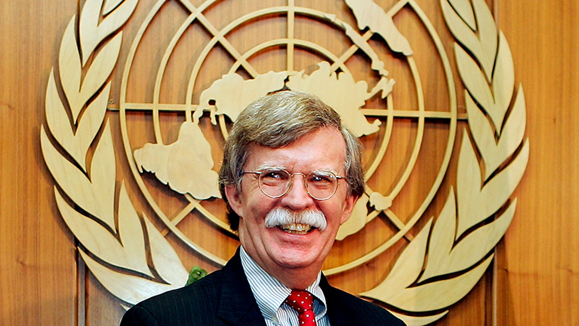 John Bolton, new United States Ambassador to the United Nations, smiles during a meeting to present his credentials to United Nations Secretary-General Kofi Annan at the U.N. headquarters in New York August 2, 2005.