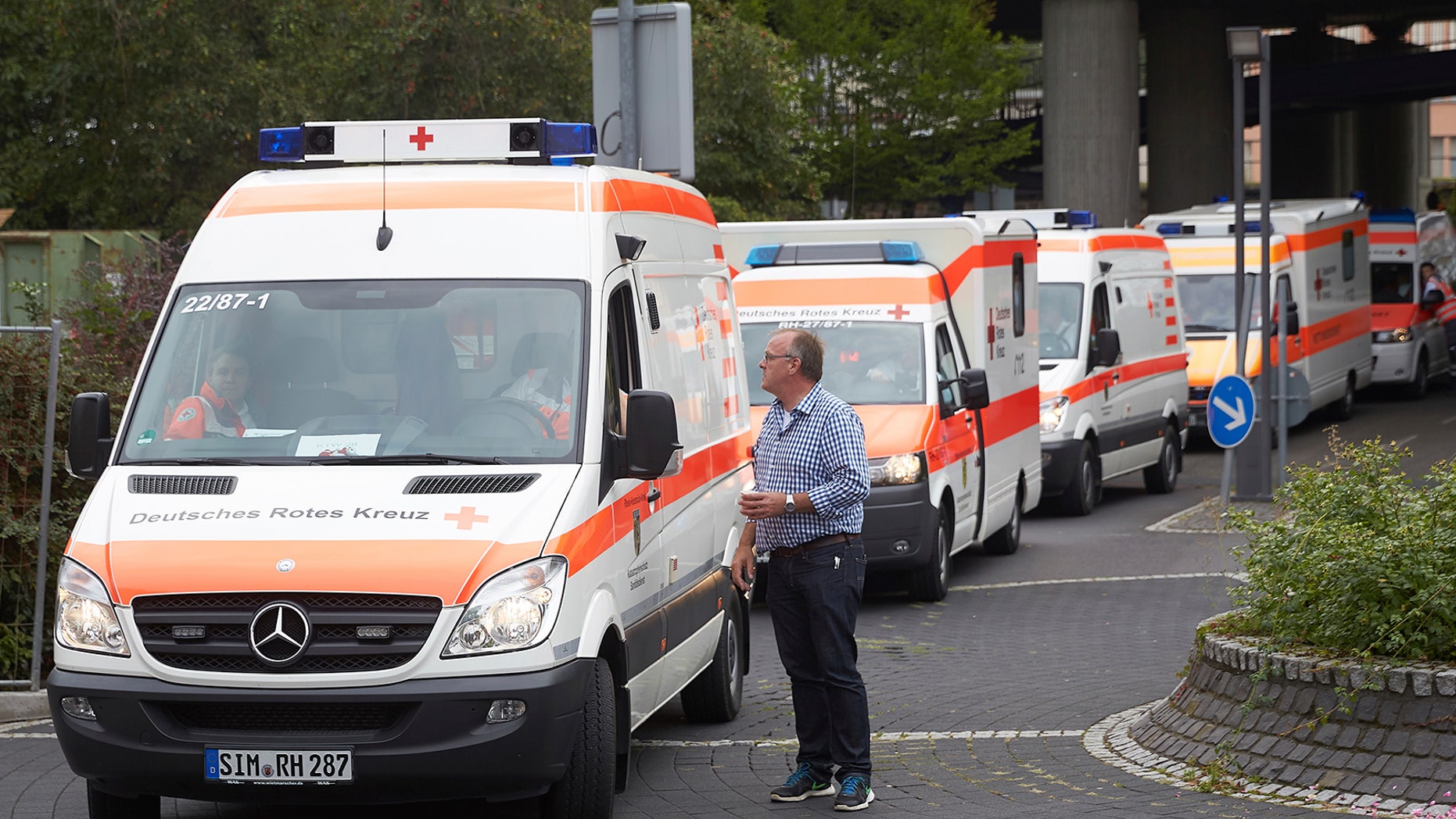 Employees of the emergency services evacuate patients from the Bruederkrankenhaus hospital in Koblenz, Germany, Saturday. Some 21,000 local residents are to be evacuated on the same day due to the defusing of a World War II aerial bomb.