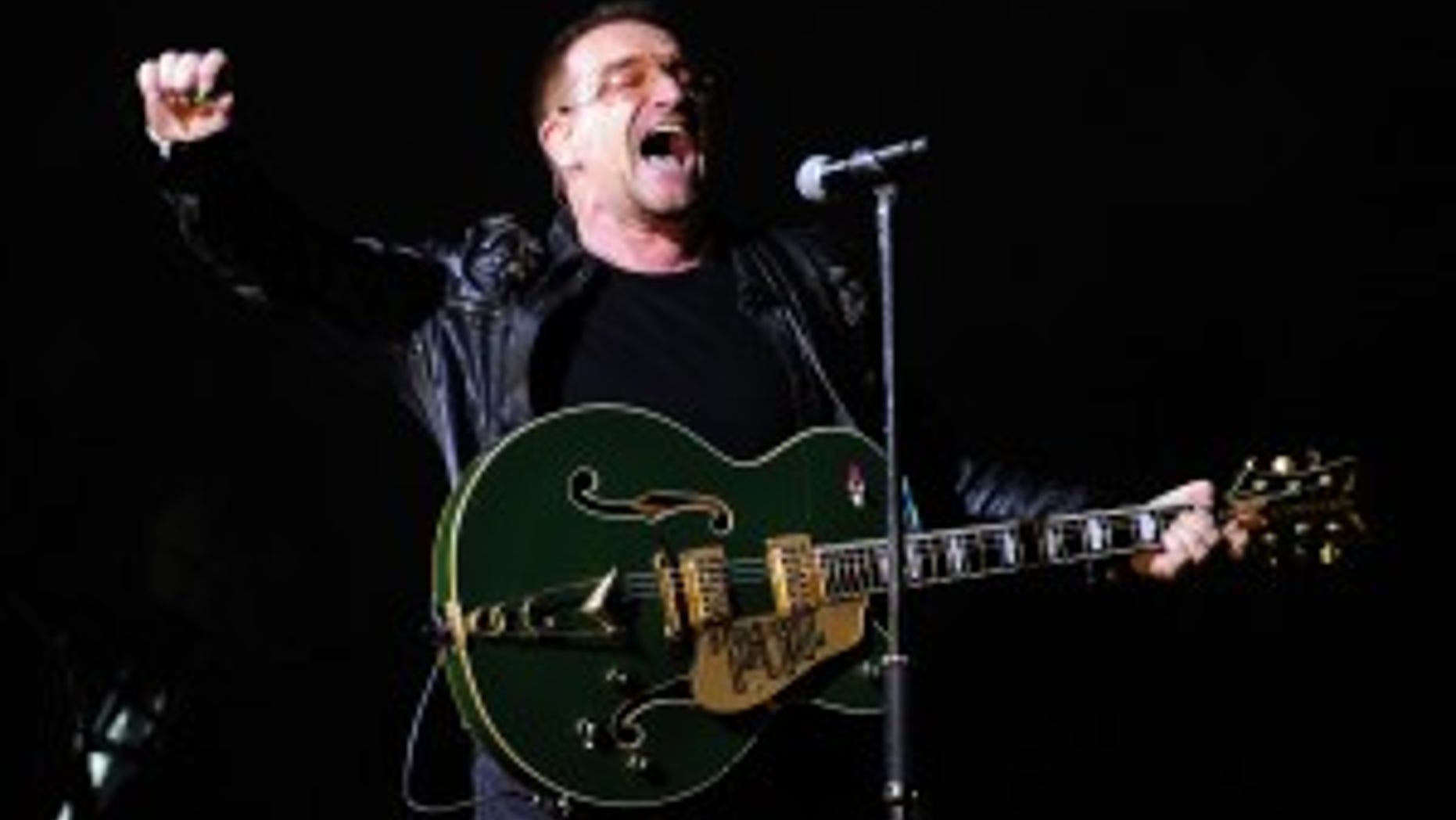 U2's Bono performs during their 360 Tour at the Camp Nou Stadium in Barcelona, Spain, Thursday, July 2, 2009. (AP Photo/Manu Fernandez)