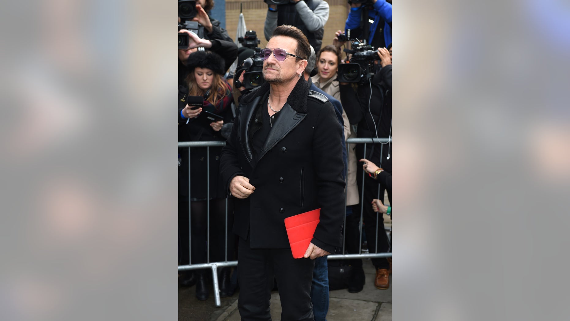 November 15, 2014. Singer Bono arrives at a music studio to record his segment of the new Band Aid 30 charity single in London.