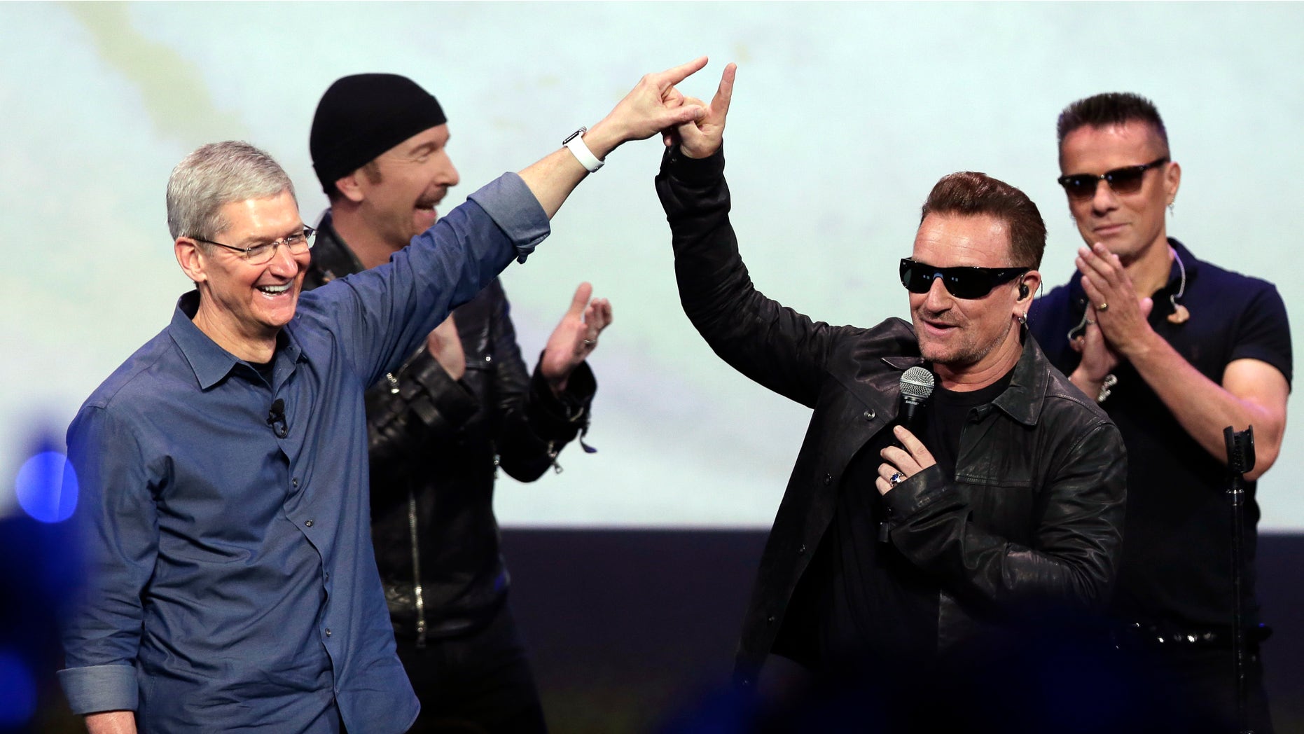 Sept. 9, 2014: Apple CEO Tim Cook, left, greets Bono from the band U2 after they preformed at the end of the Apple event in Cupertino, Calif.