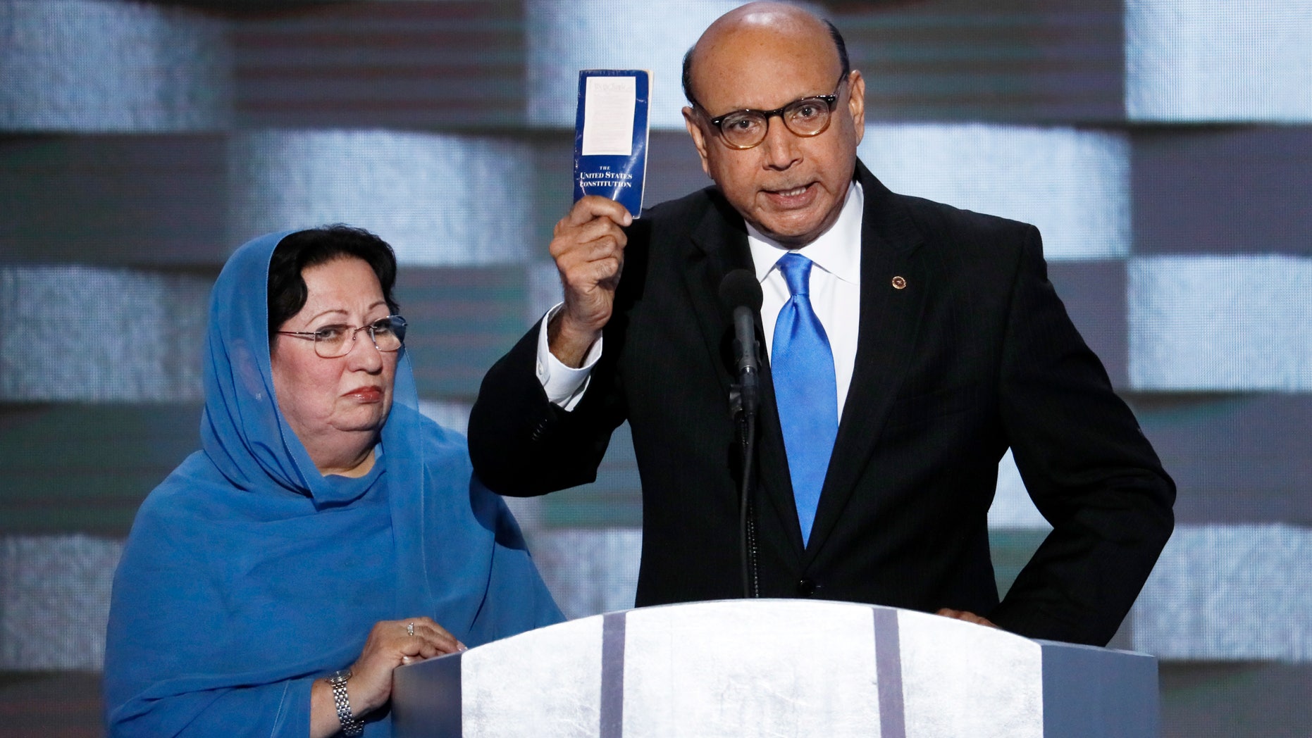 July 28, 2016: Khizr Khan, father of fallen US Army Capt. Humayun S. M. Khan holds up a copy of the Constitution of the United States as his wife listens during the final day of the Democratic National Convention in Philadelphia.