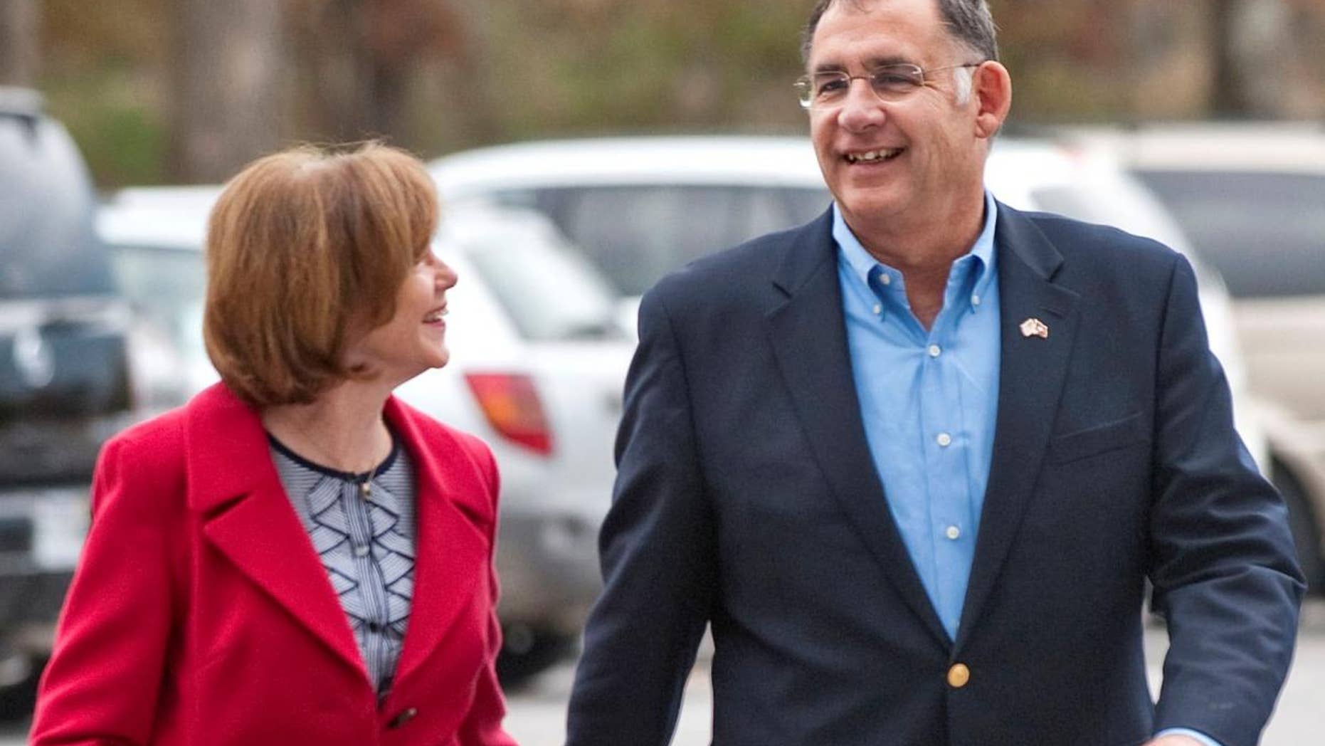 Sen. John Boozman walks with his wife, Cathy Boozman. (AP File Photo/Beth Hall)