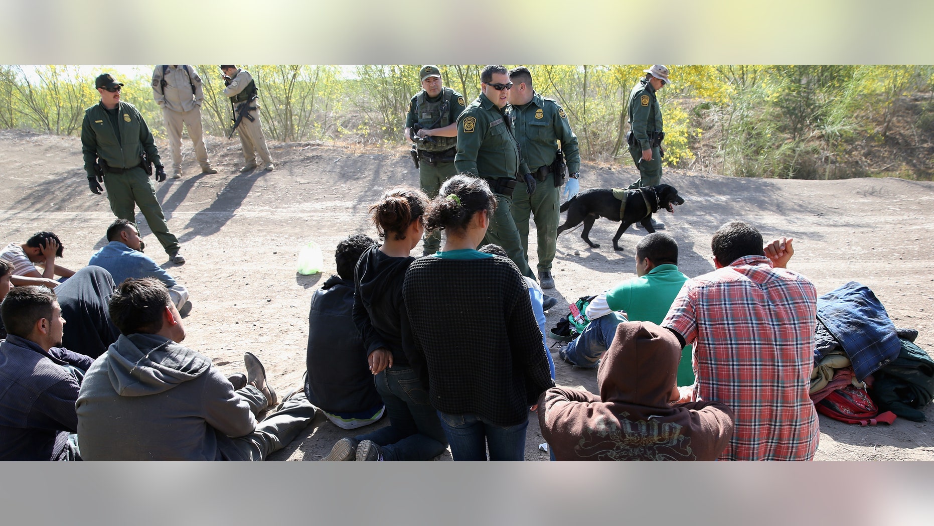 U.S. Border Patrol and U.S. Air and Marine agents detain undocumented immigrants near the U.S.-Mexico border on April 11, 2013 near Mission, Texas.