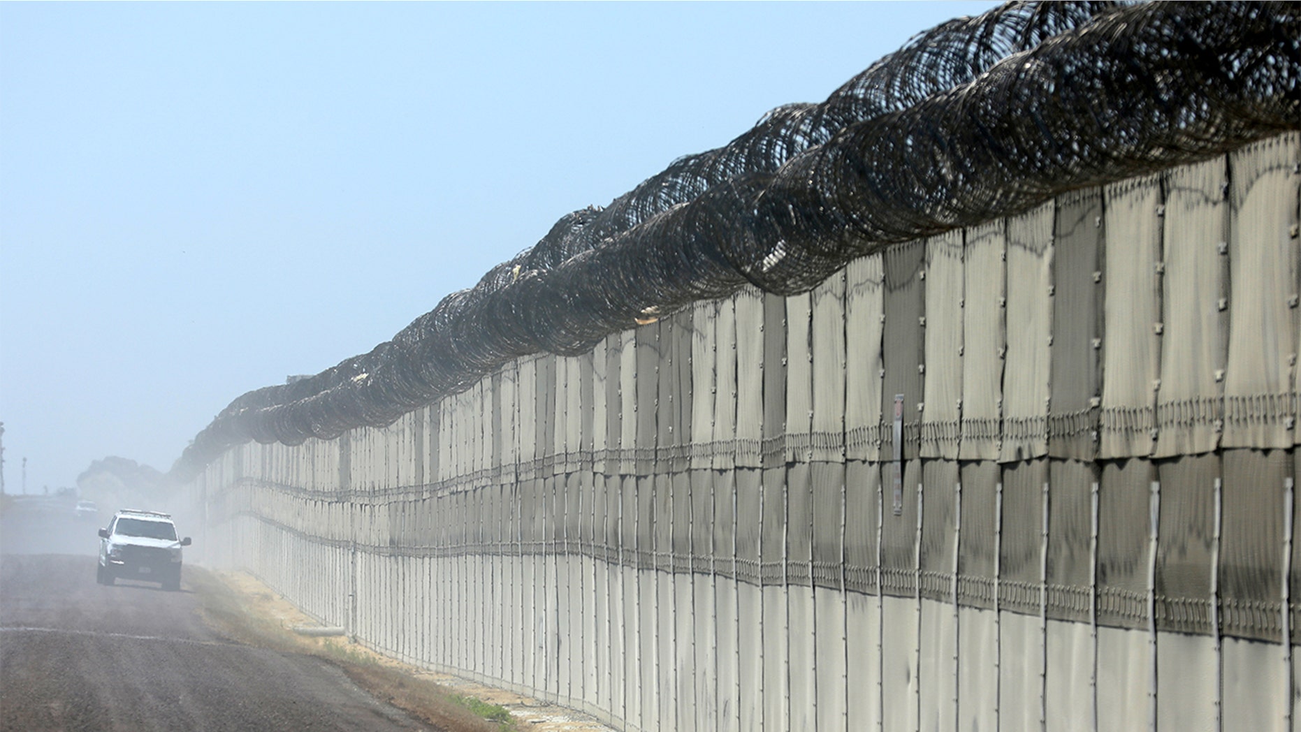 A U.S. border patrol agent fatally shot an illegal immigrant in Texas Wednesday, authorities said. File photo showing the fence along the U.S. southern border.