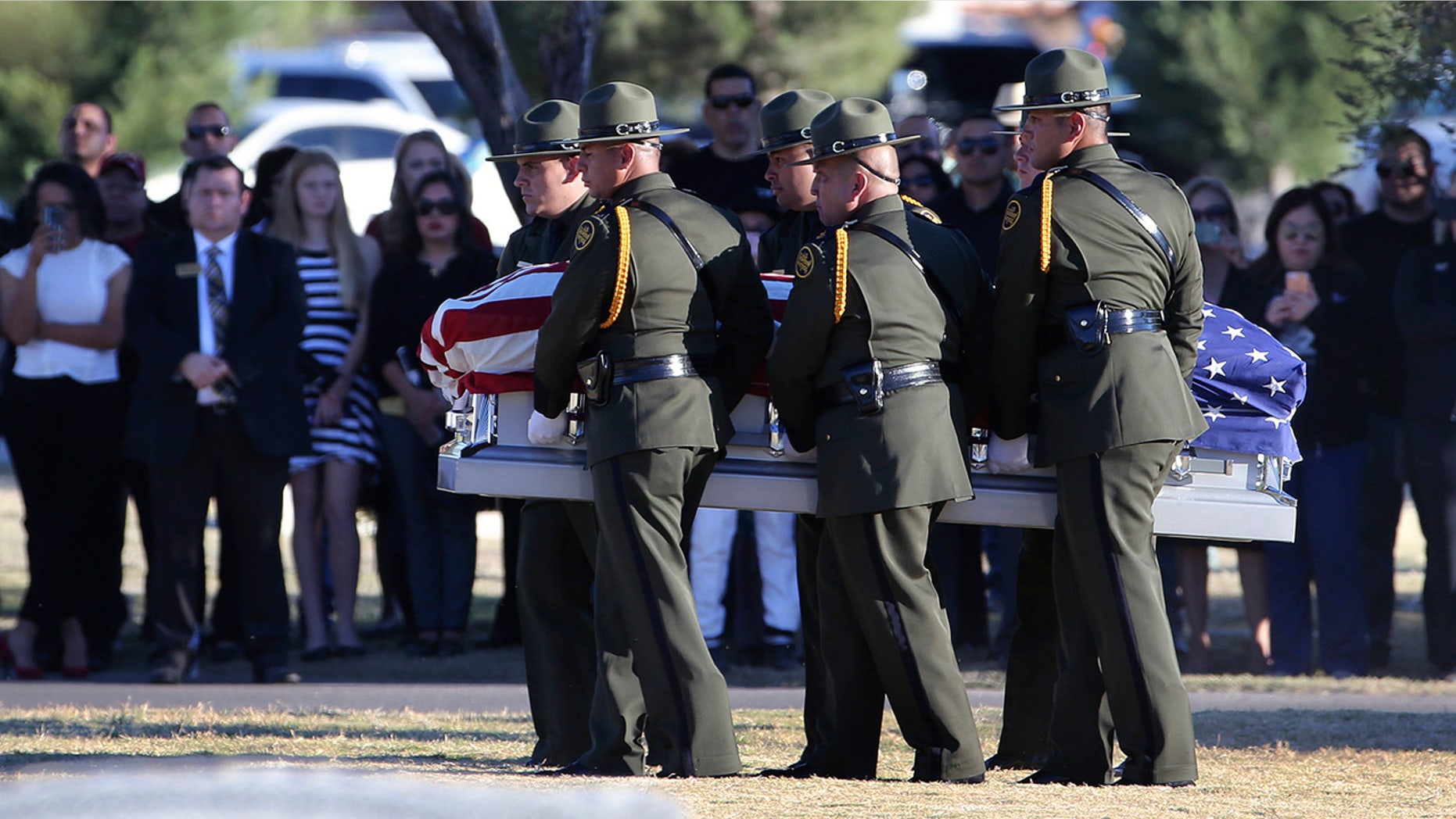 Border Patrol agents carry the coffin of Rogelio Martinez to a graveside service at Restlawn Cemetery in El Paso Saturday