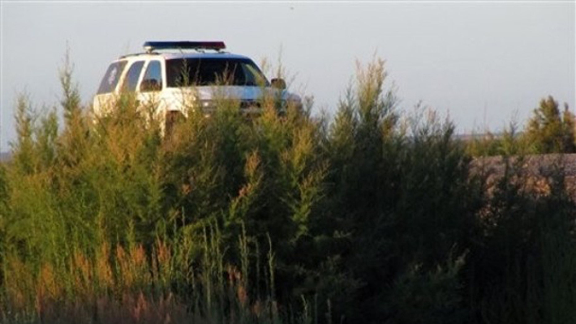 FILE: A U.S. Border Patrol truck is seen parked above a footbridge connecting Mexico with Texas. It would not be abandoned in the event of a government shutdown.