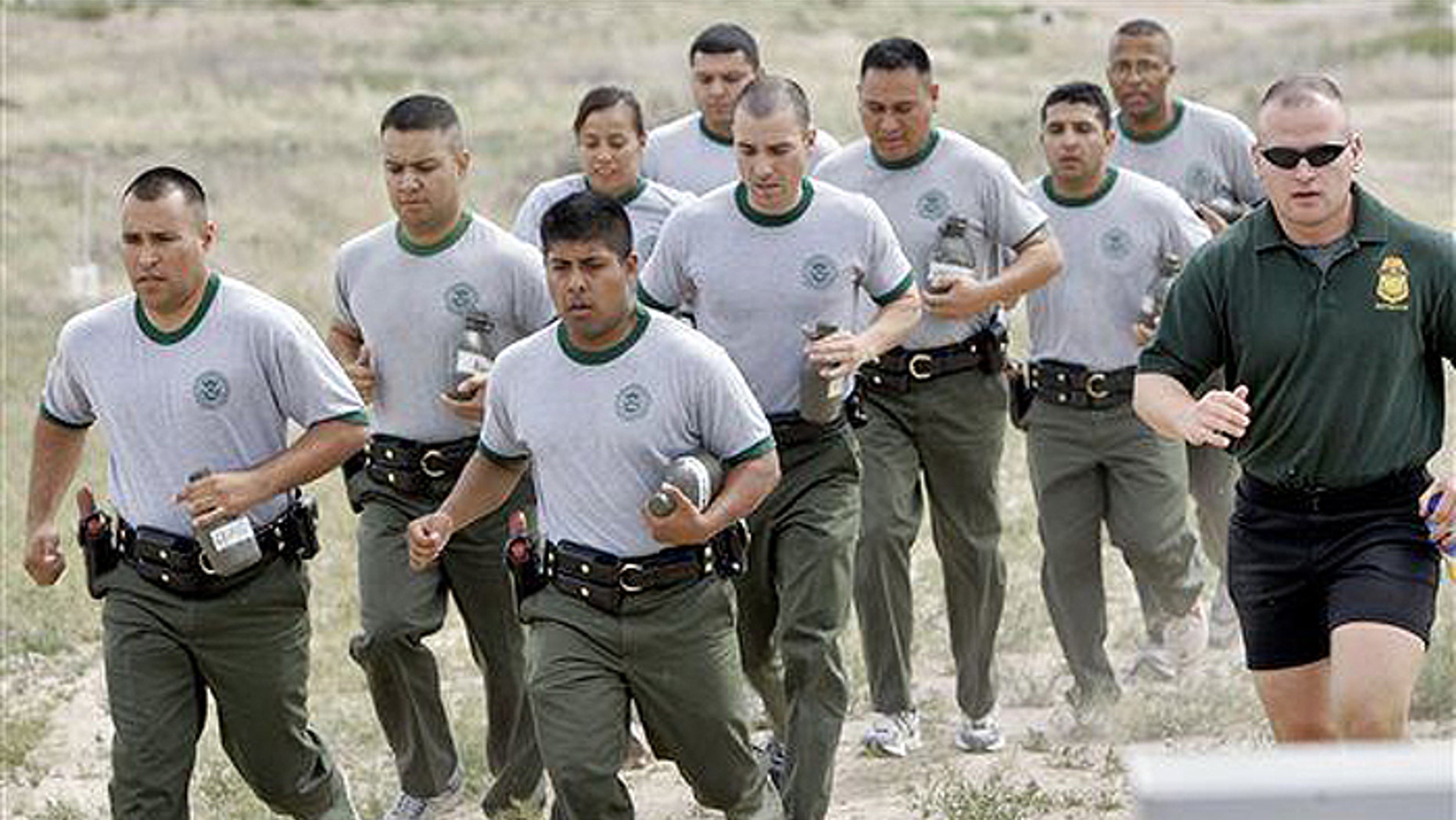 The government plans to house illegal immigrants at the same facility where the men and women charged with keeping them out are trained. (AP file)