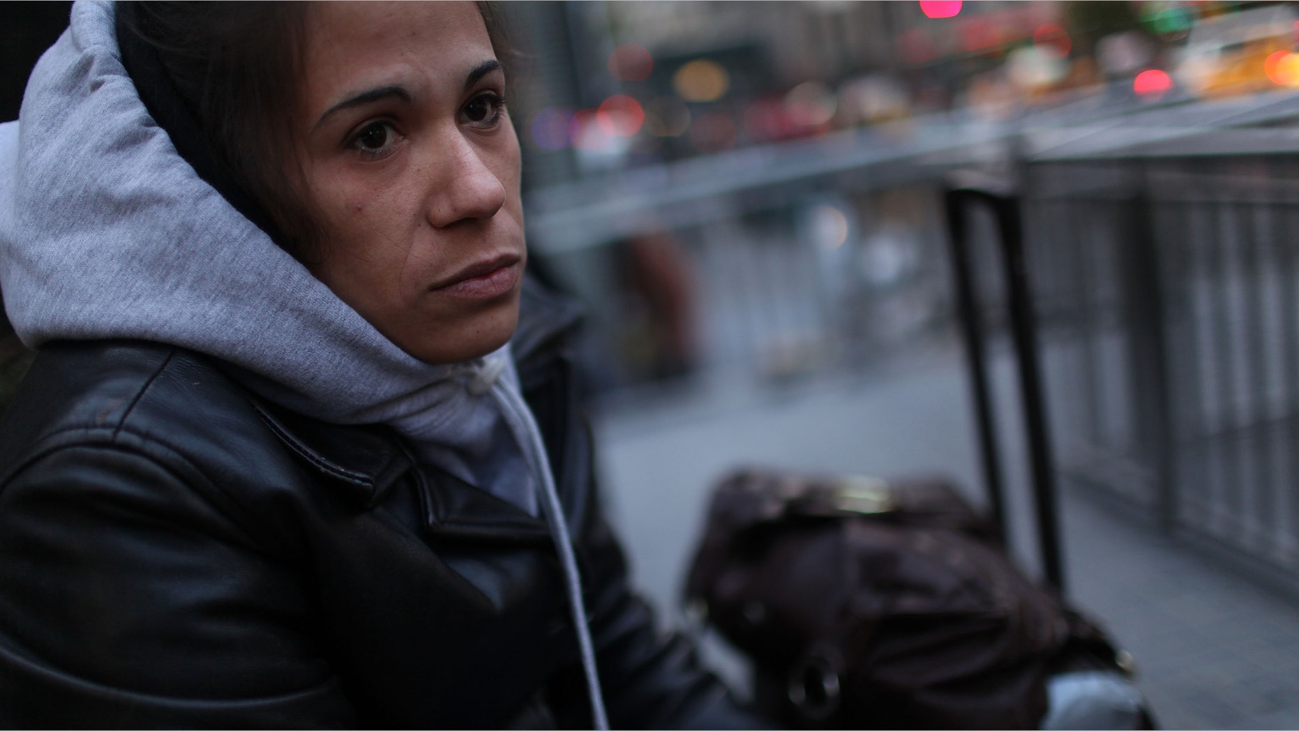 NEW YORK - OCTOBER 26: Ivan Burdos from Puerto Rico sits by her bags while waiting for her husband October 26, 2009 in New York, New York. Burdos and her husband have recently found themselves homeless following a move to New York from Puerto Rico. In a recently released report by the advocacy group Coalition for the Homeless it was revealed that the numbers of homeless people using New York City shelters each night has reached an all time high. Since Mayor Michael Bloomberg took office eight years ago there has been a 45 percent increase in shelter use with over 39,000 homeless people, including 10,000 homeless families, checking in to city shelters every evening. The group also said that 2009 has turned out to be 'the worst on record for New York City homelessness since the Great Depression. (Photo by Spencer Platt/Getty Images) *** Local Caption *** Ivan Burdos
