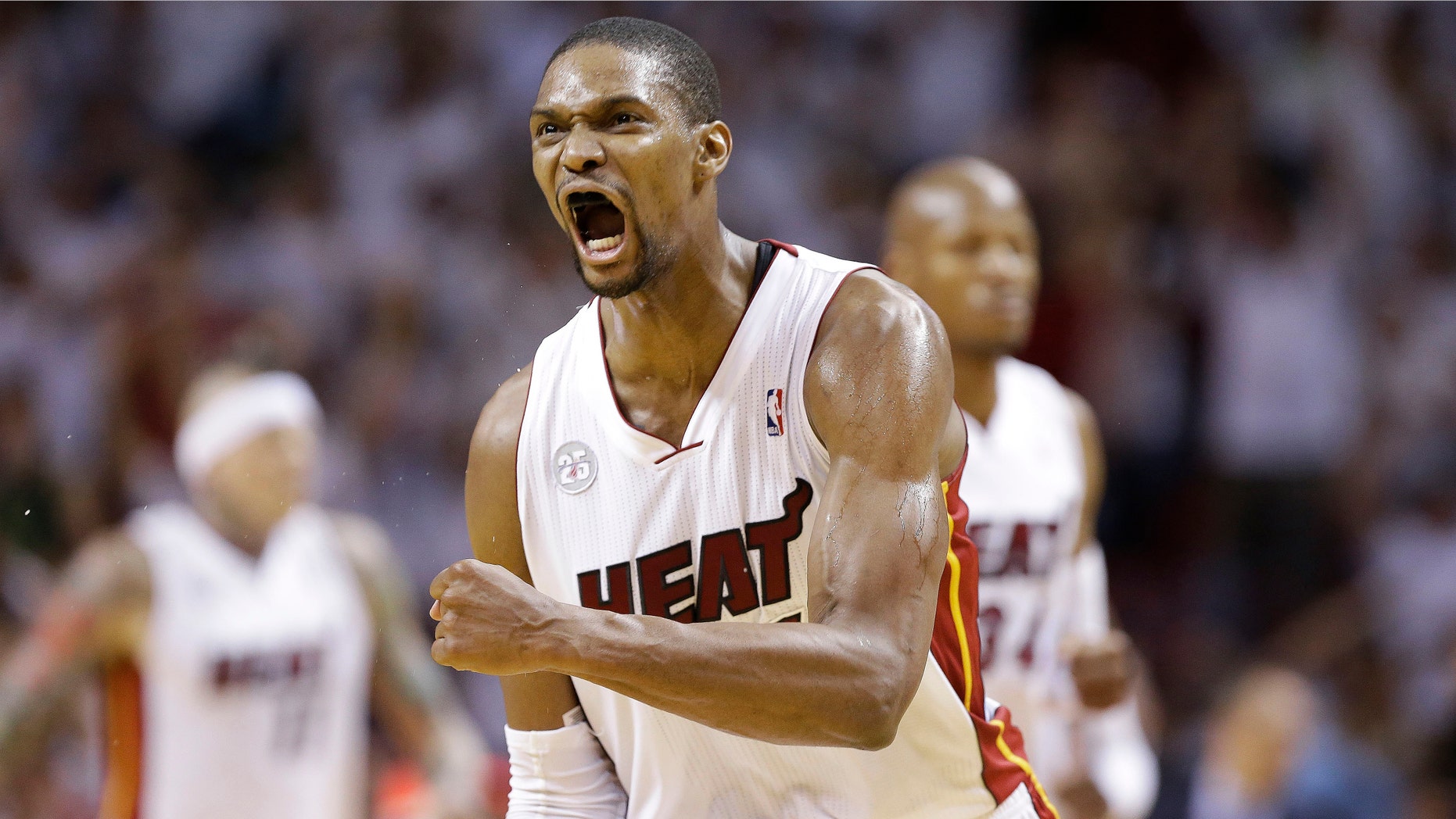 Miami Heat center Chris Bosh (1) reacts against the Indiana Pacers during the first half of Game 7 in their NBA basketball Eastern Conference finals playoff series, Monday, June 3, 2013 in Miami. (AP Photo/Lynne Sladky)