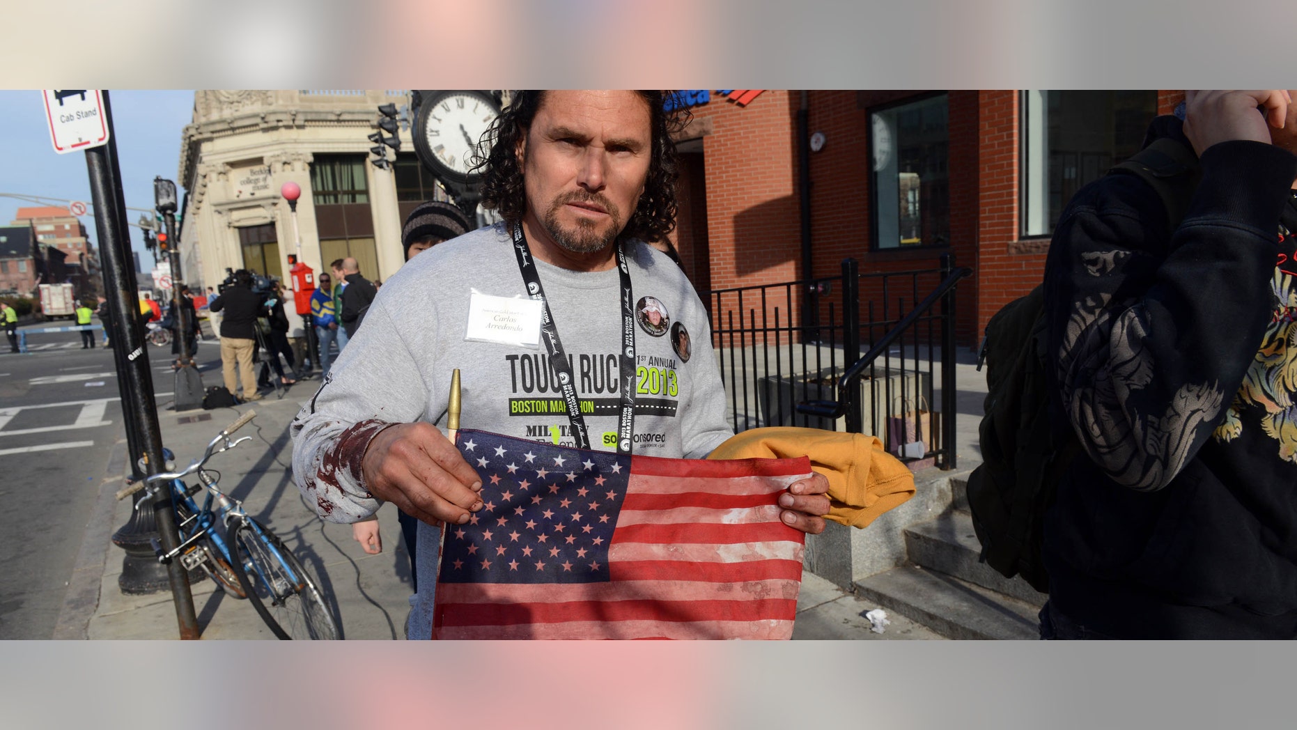 BOSTON, MA - APRIL 15: Carlos Arredondo, who was at the finish line of the 117th Boston Marathon when two explosives detonated, leaves the scene on April 15, 2013 in Boston, Massachusetts. Two people are confirmed dead and at least 28 injured after at least two explosions went off near the finish line to the marathon. (Photo by Darren McCollester/Getty Images)
