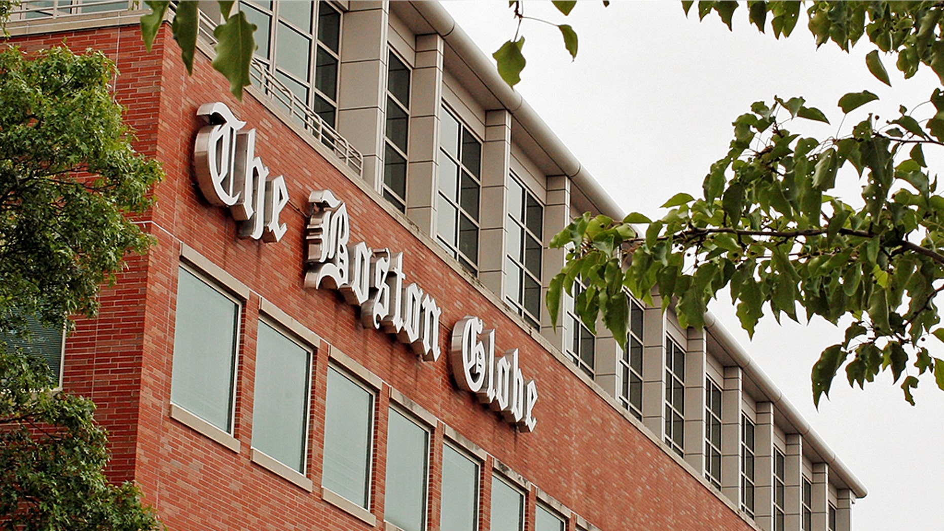A man was arrested after threatening employees at the Boston Globe several times after the newspaper published an editorial against President Trump's attacks on the media, officials said.