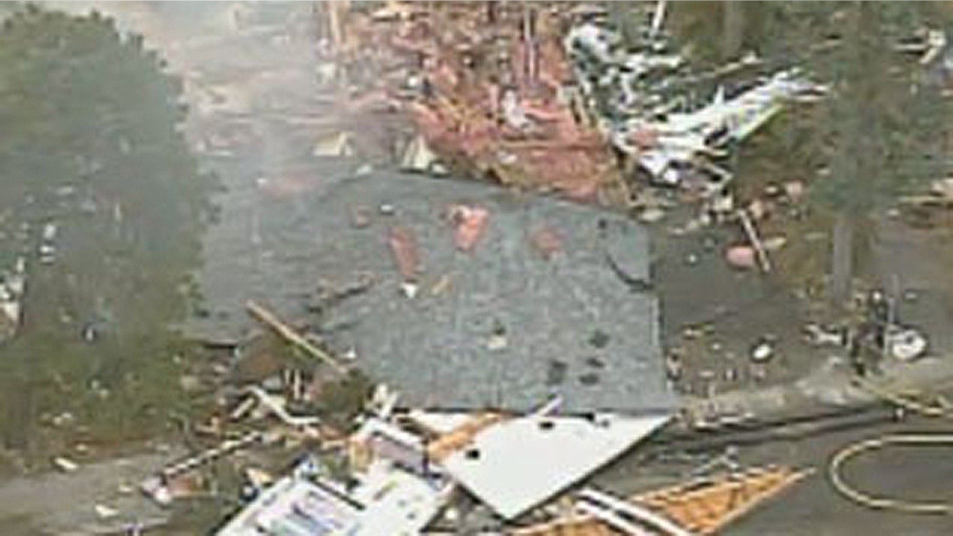 There was no immediate indication as to what caused the explosion at the Boston home seen here, but witnesses reported smelling natural gas, and construction crews were working in the area. (MyFoxBoston.com)