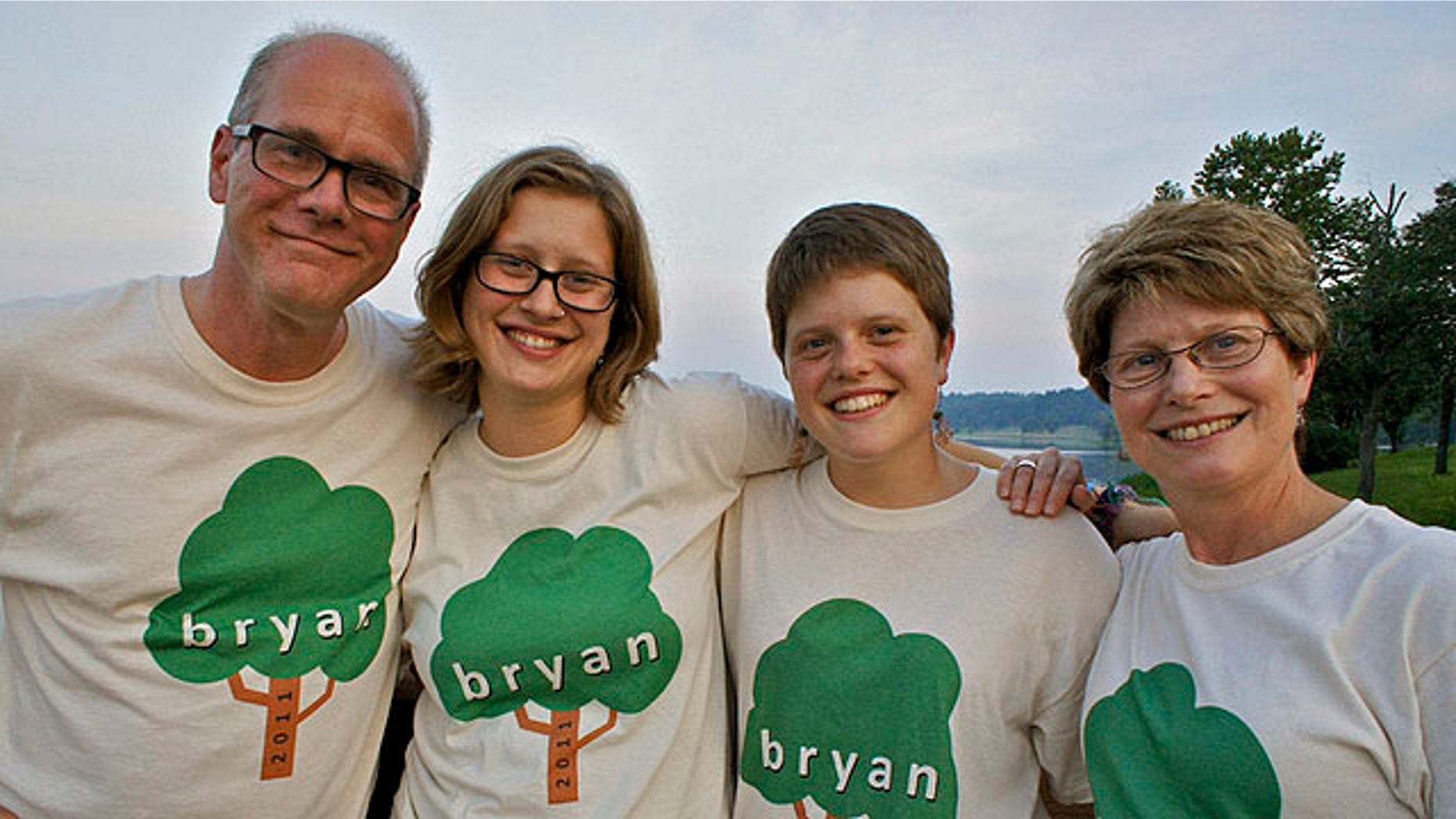 This undated family handout photo shows missing bicyclist Mark Bosworth, left, with his wife Julie, right, daughters Claire, middle right, and Kelly at a family reunion.