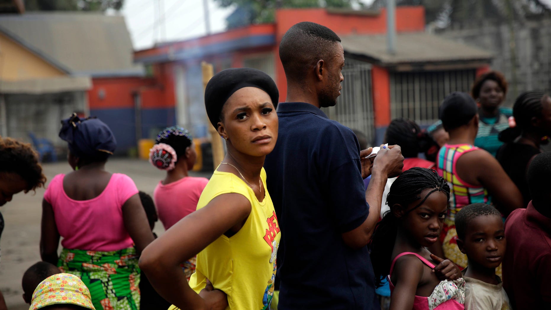 Residents of the Kisenso district of Kinshasa, Congo, line up to receive yellow fever vaccines on Thursday, July 21, 2016. Some experts say about 40 million vaccines are needed to extinguish the outbreak _ enough to immunize everyone in Angola and Kinshasa. To date, the World Health Organization and partners say they have shipped more than 18 million doses of yellow fever vaccine for emergency campaigns. They are 22 million doses short. (AP Photo/Jerome Delay)