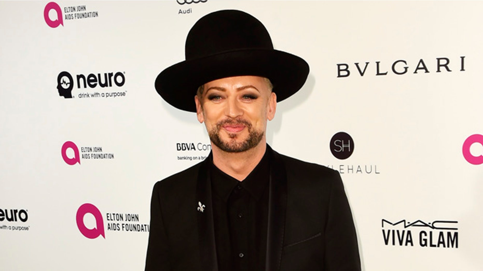 Boy George defended Melania Trump while at Paris Fashion Week.