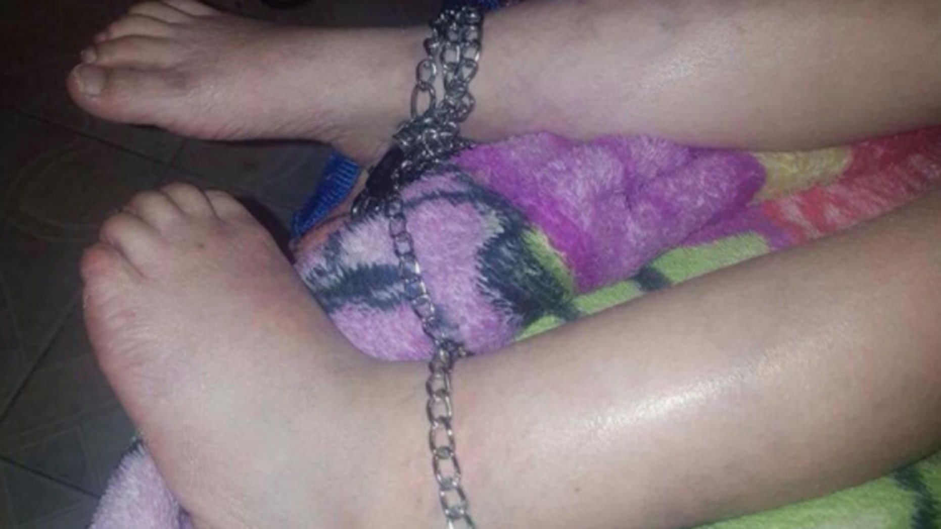 The 5-year-old boy was found with chains on his ankles.