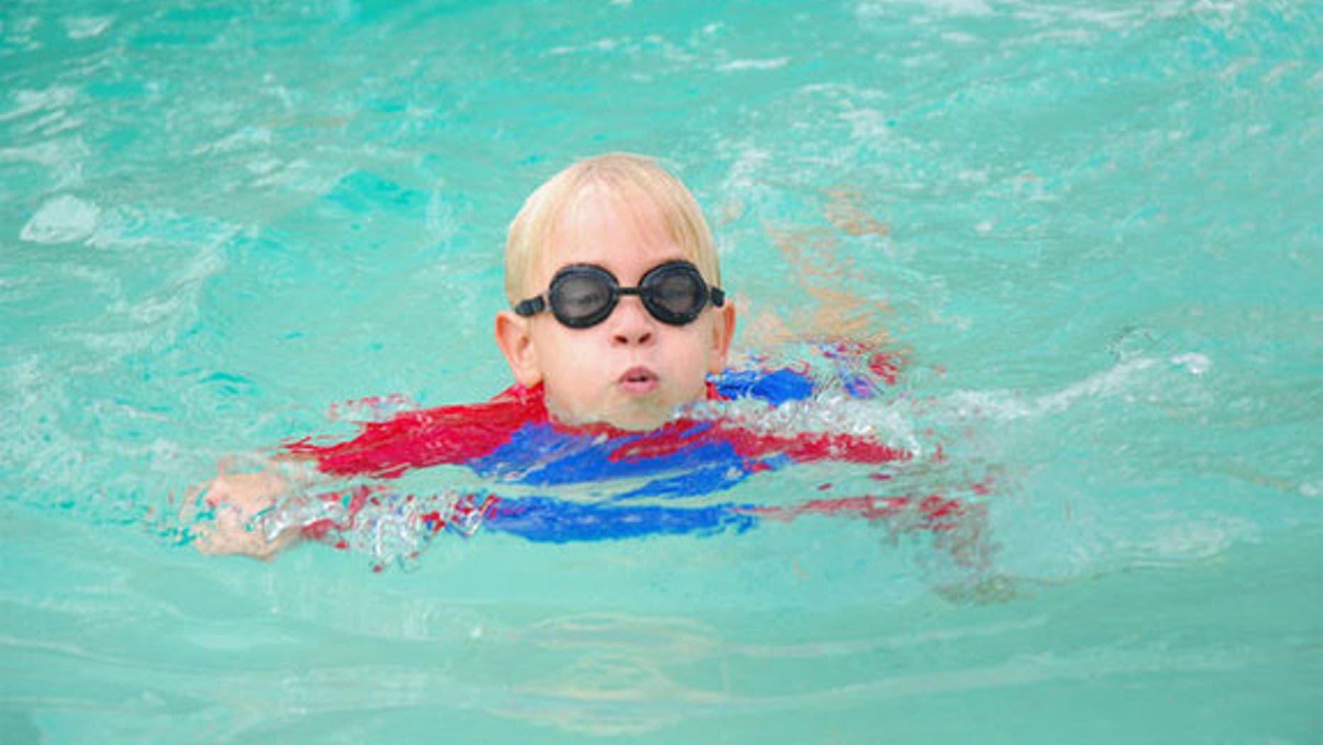 Boy in swimming pool.