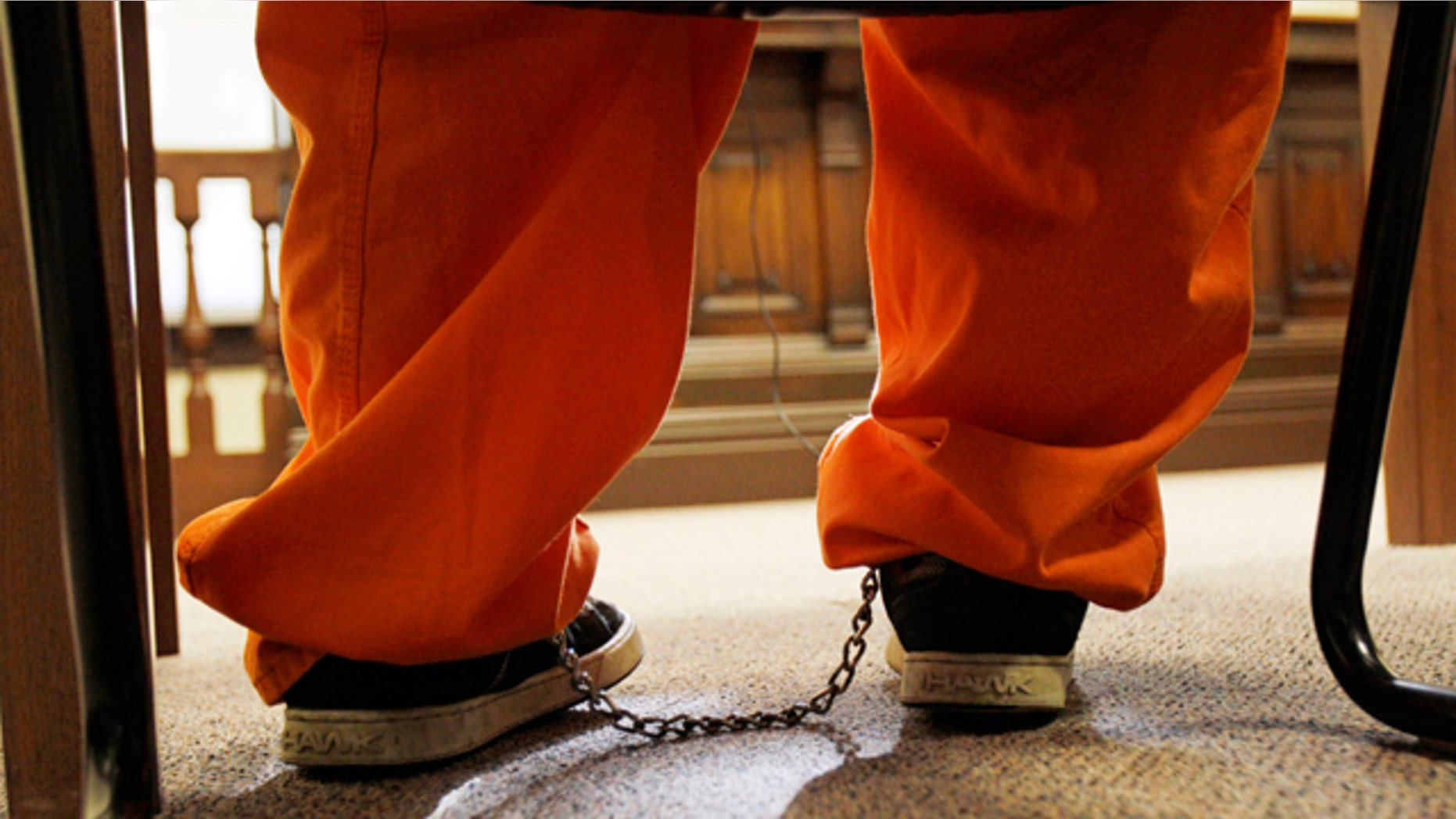 Jan. 3: A 10-year old boy sits with leg irons in a courtroom during his court appearance in Millersburg, Ohio. The boy has been charged as a juvenile with murder in the fatal shooting of his mother after authorities said he told a neighbor about the killing. (AP)