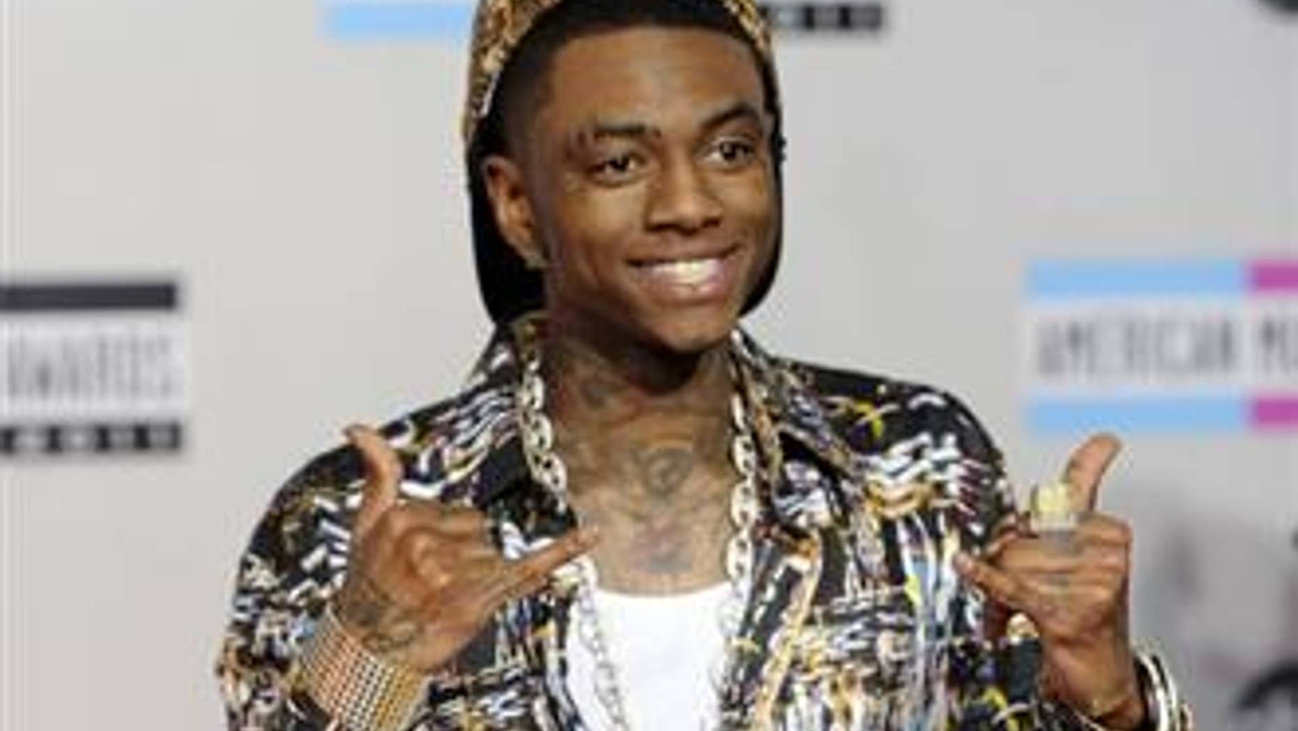 Soulja Boy, seen in 2011, will fight rapper Chris Brown in a pay-per-view fight in March in Las Vegas.