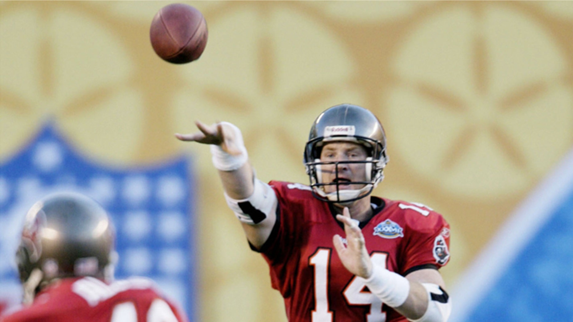 Jan. 26, 2003: Tampa Bay Buccaneers' quarterback Brad Johnson (14) throws to fullback Mike Alstott (40) for a first down in the second quarter of Super Bowl XXXVII, in San Diego.