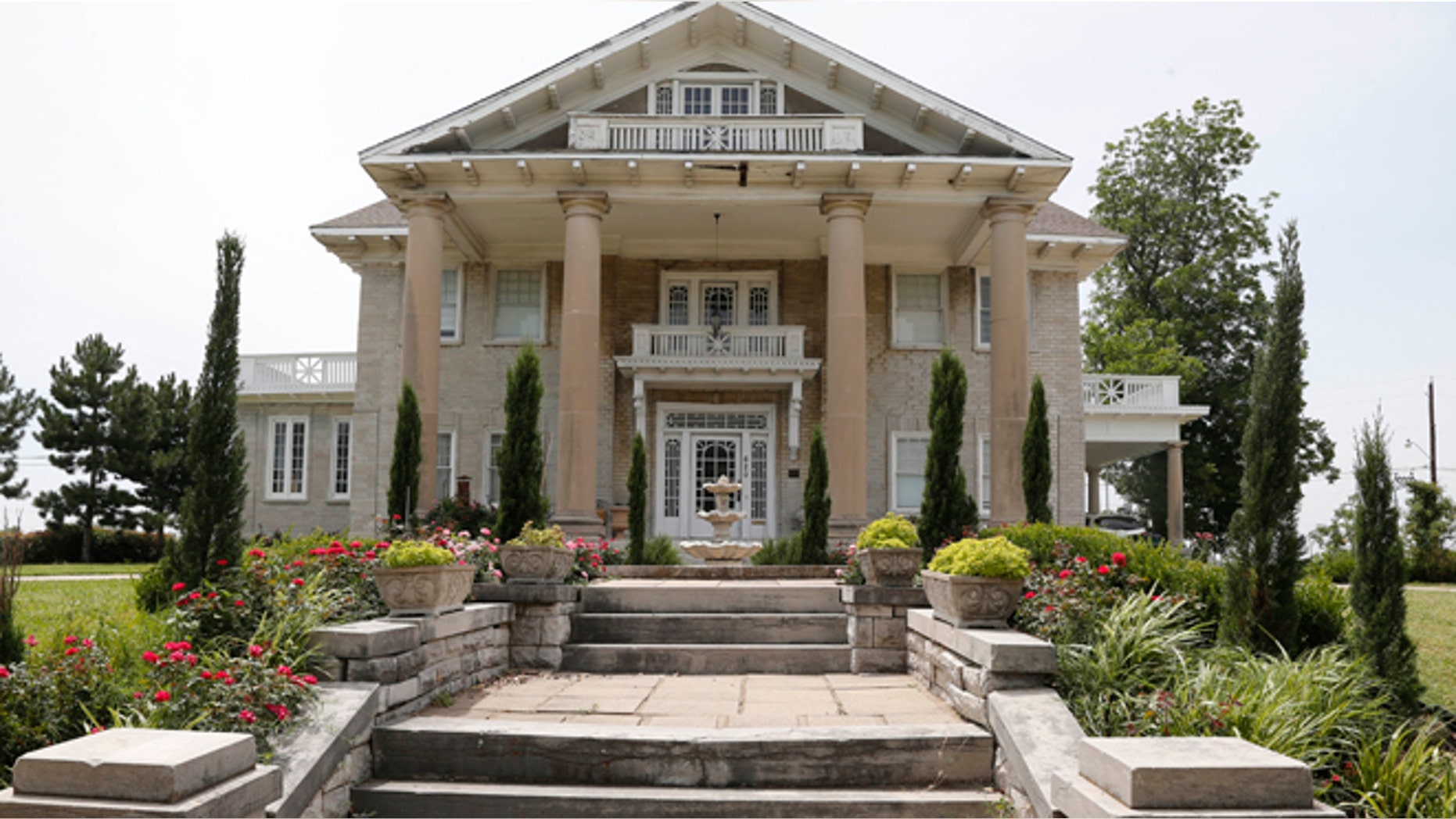 June 27, 2013: The Brady Mansion is pictured in Tulsa, Okla. The Kufdakis family, Greek and Puerto Rican immigrants, bought the grand Brady Mansion in 2009. (AP/Sue Ogrocki)