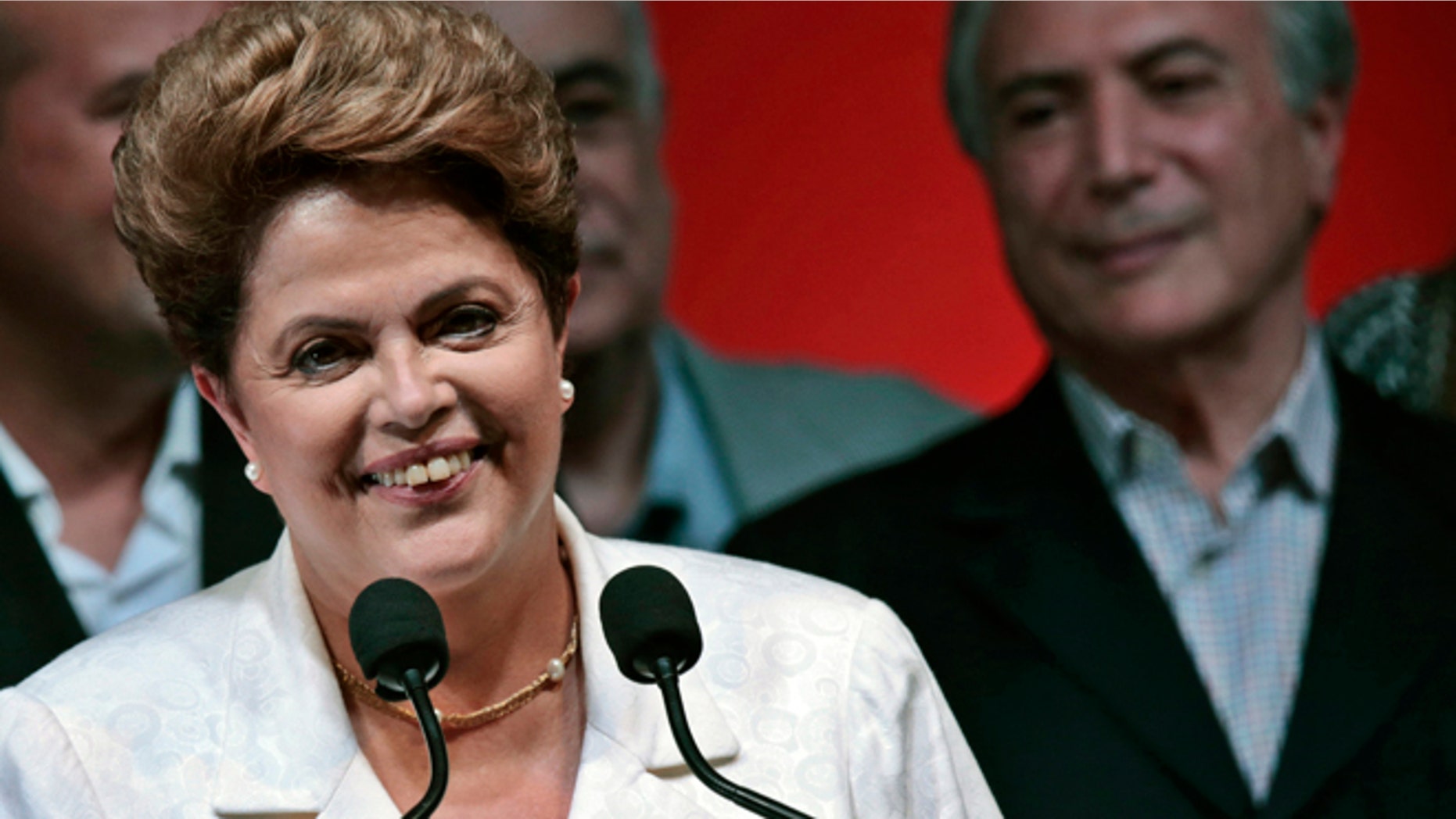 Oct. 26: Dilma Rousseff smiles during news conference after disclosure of the election results, in Brasilia.