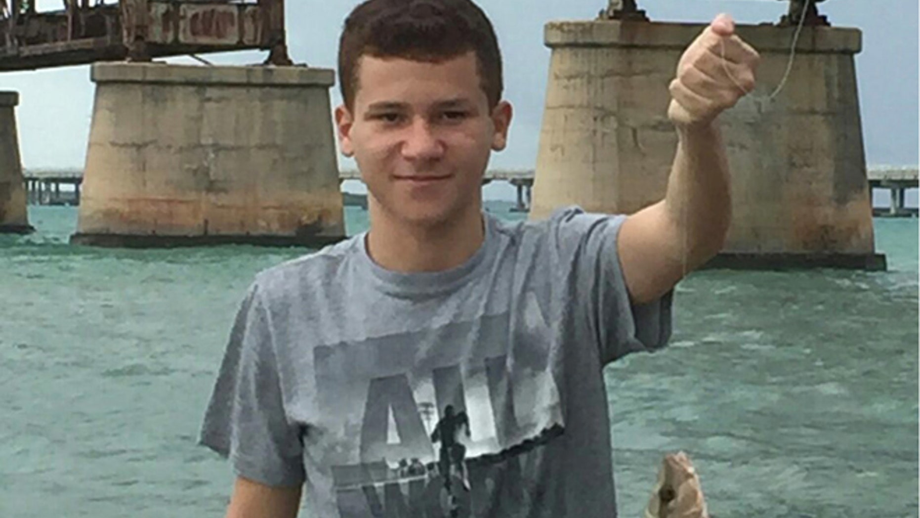 This undated photo released by Florida Hospital Orlando, shows Sebastian DeLeon on a fishing outing.