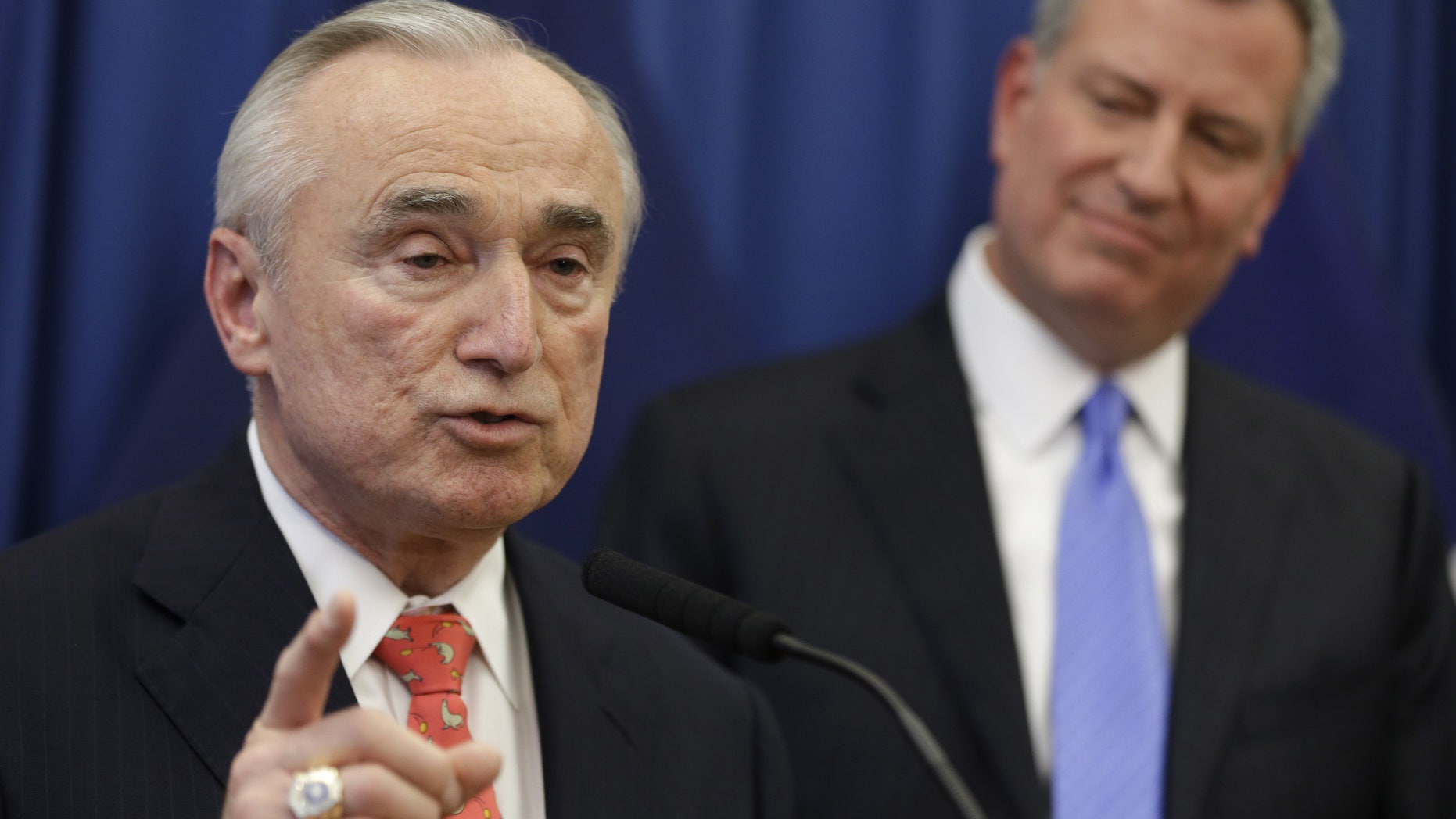 FILE - In this Dec. 5, 2013 file photo, William Bratton, left, speaks while New York Mayor-elect Bill de Blasio looks on during a news conference in New York introducing Bratton as de Blasio's choice for New York City police commissioner. Although Bratton is a proponent of the police tactic known as stop and frisk, which de Blasio says was used too much during the Bloomberg years, both men have pledged to better explain the use of the tactic and de Blasio has vowed to drop the Bloomberg administrations objections to a pair of watchdogs - both an independent general and a federal monitor - who have been tasked with overseeing the NYPD. (AP Photo/Seth Wenig, File)