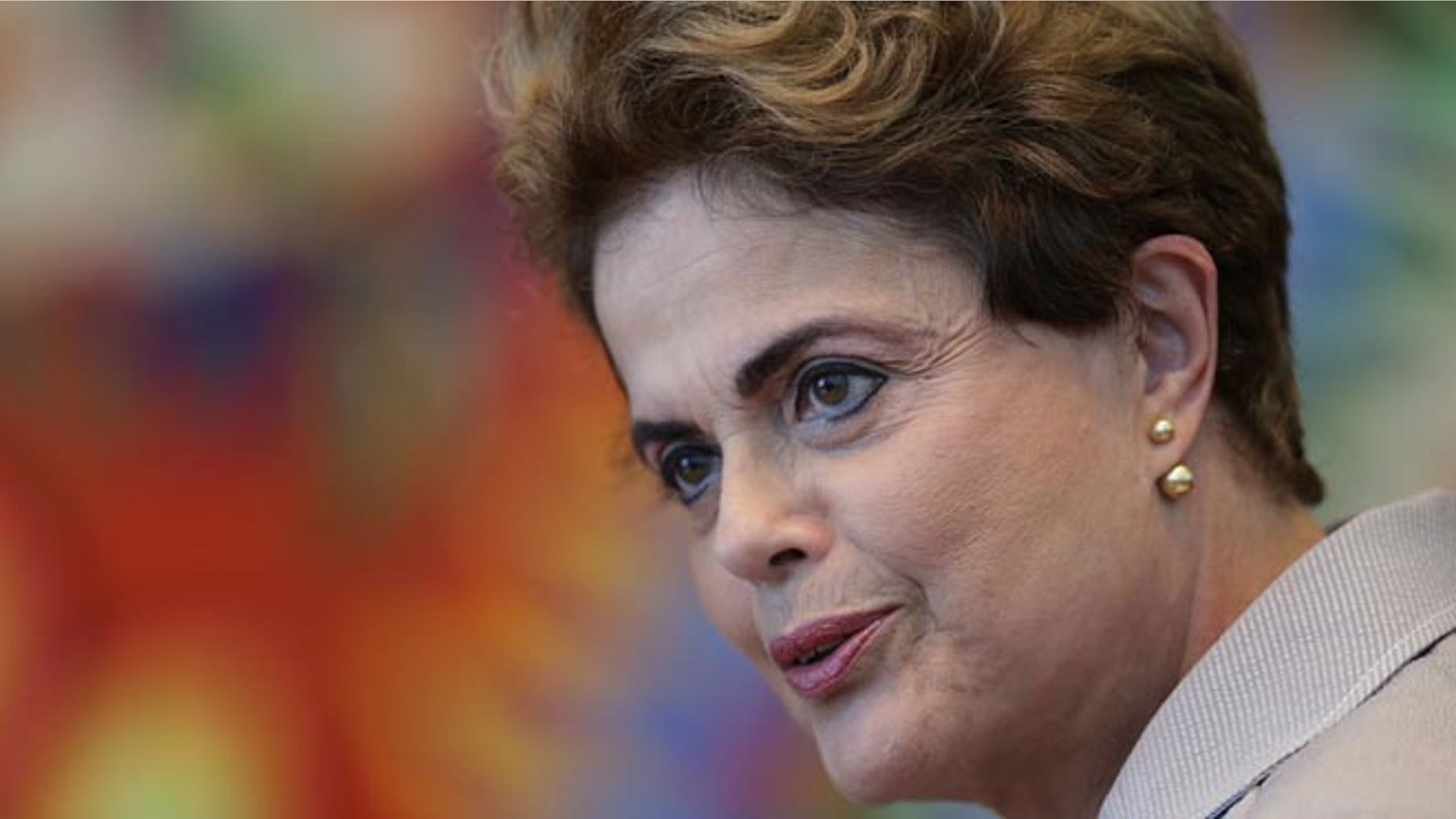 FILE - In this June 14, 2016 file photo, suspended Brazilian President Dilma Rousseff speaks during a press conference for foreign journalists at the Alvorada residential palace, in Brasilia, Brazil. Brazil's Senate voted Wednesday, Aug. 10, 2016, to put Rousseff on trial for allegedly breaking fiscal rules in her managing of the federal budget. (AP Photo/Eraldo Peres, File)