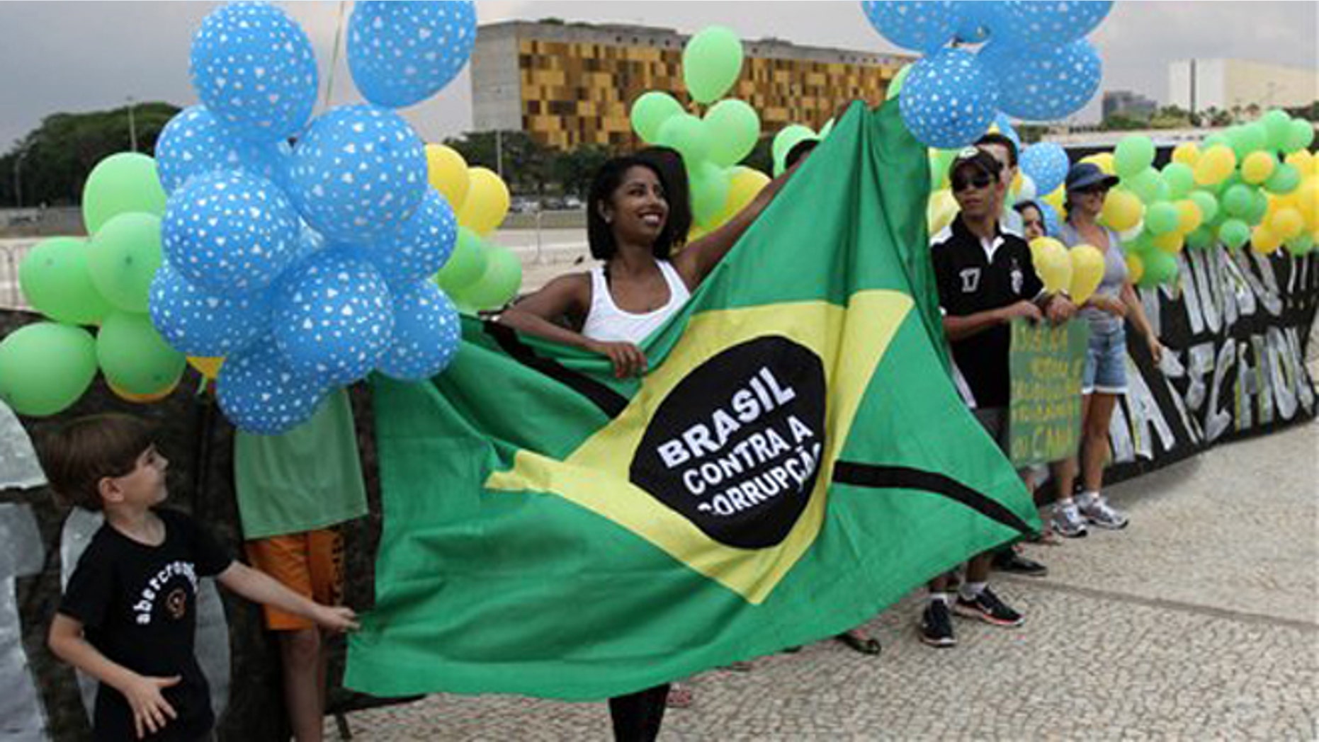 Members of an anti-corruption group protest in front of the Brazil's supreme court building calling for clean government, in Brasilia, Brazil.