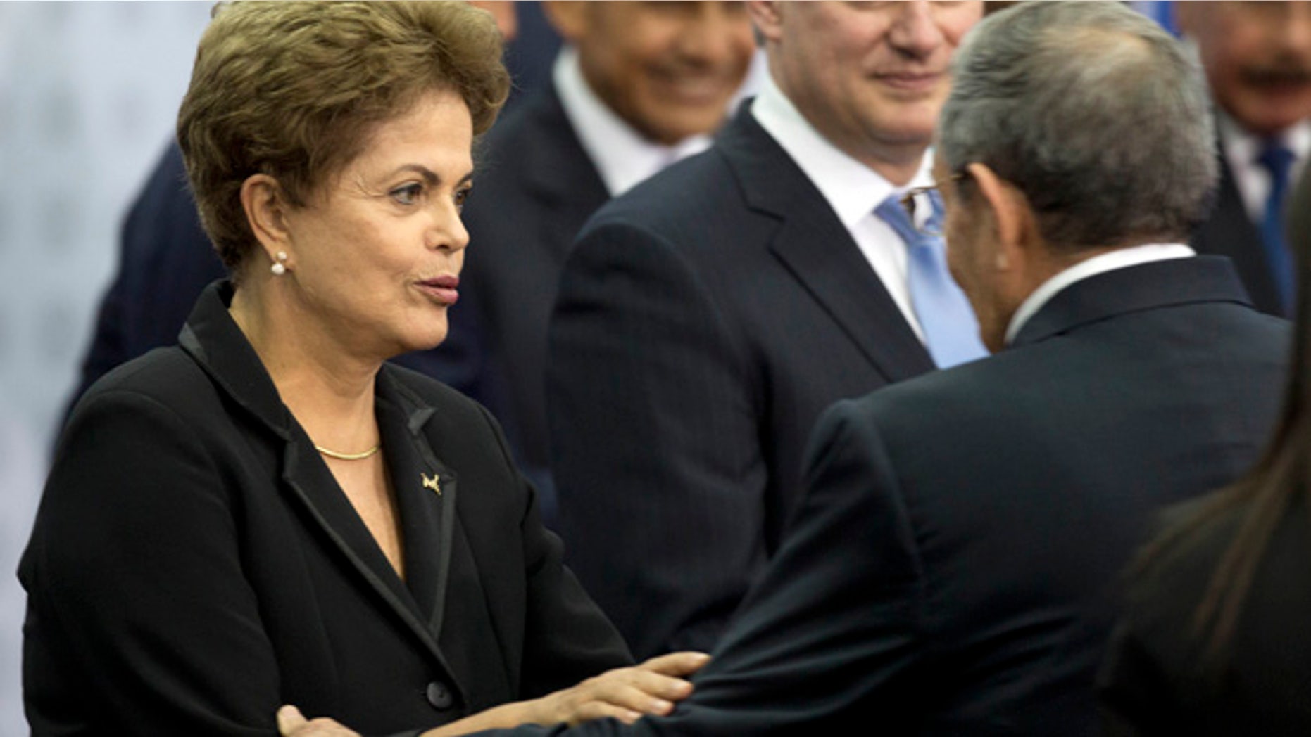 Apr. 11, 2015: Brazil's President Dilma Rousseff greets Cuba's President Raul Castro as they arrive for the oficial group photo of the VII Summit of the Americas in Panama City, Panama. (AP)