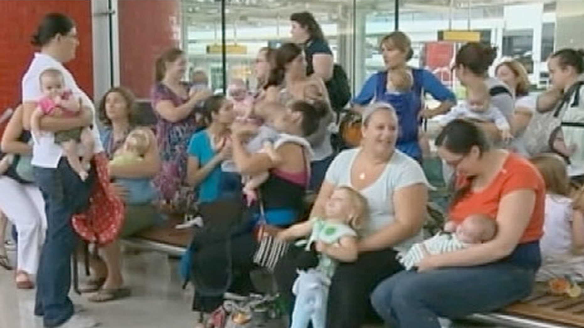 A group of about 25 nursing mothers and their nursing children gathered Wednesday at Baltimore-Washington International Thurgood Marshall Airport to protest the airlines.