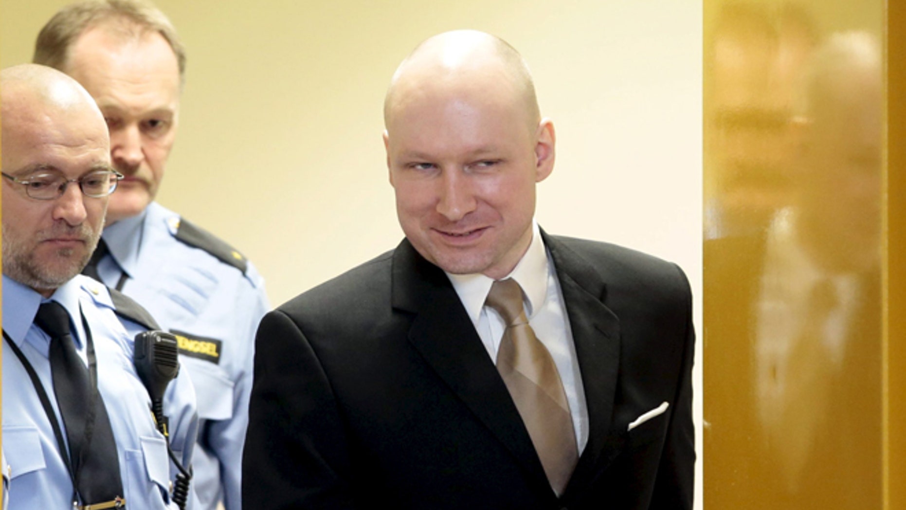March 15, 2016: Mass killer Anders Behring Breivik is escorted by prison guards as he enters the court room in Skien prison. He recently filed a claim that his human rights were violated by being in solitary confinement. (Reuters)