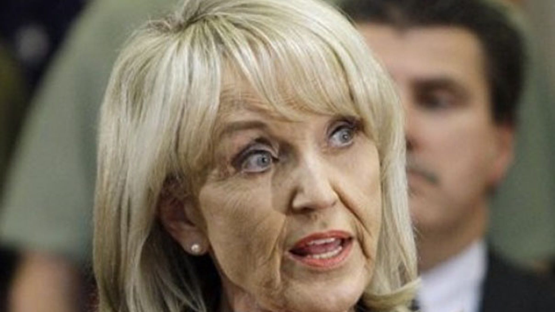 Arizona Gov. Jan Brewer speaks during a news conference after signing her state's immigration bill April 23 in Phoenix. (AP Photo)