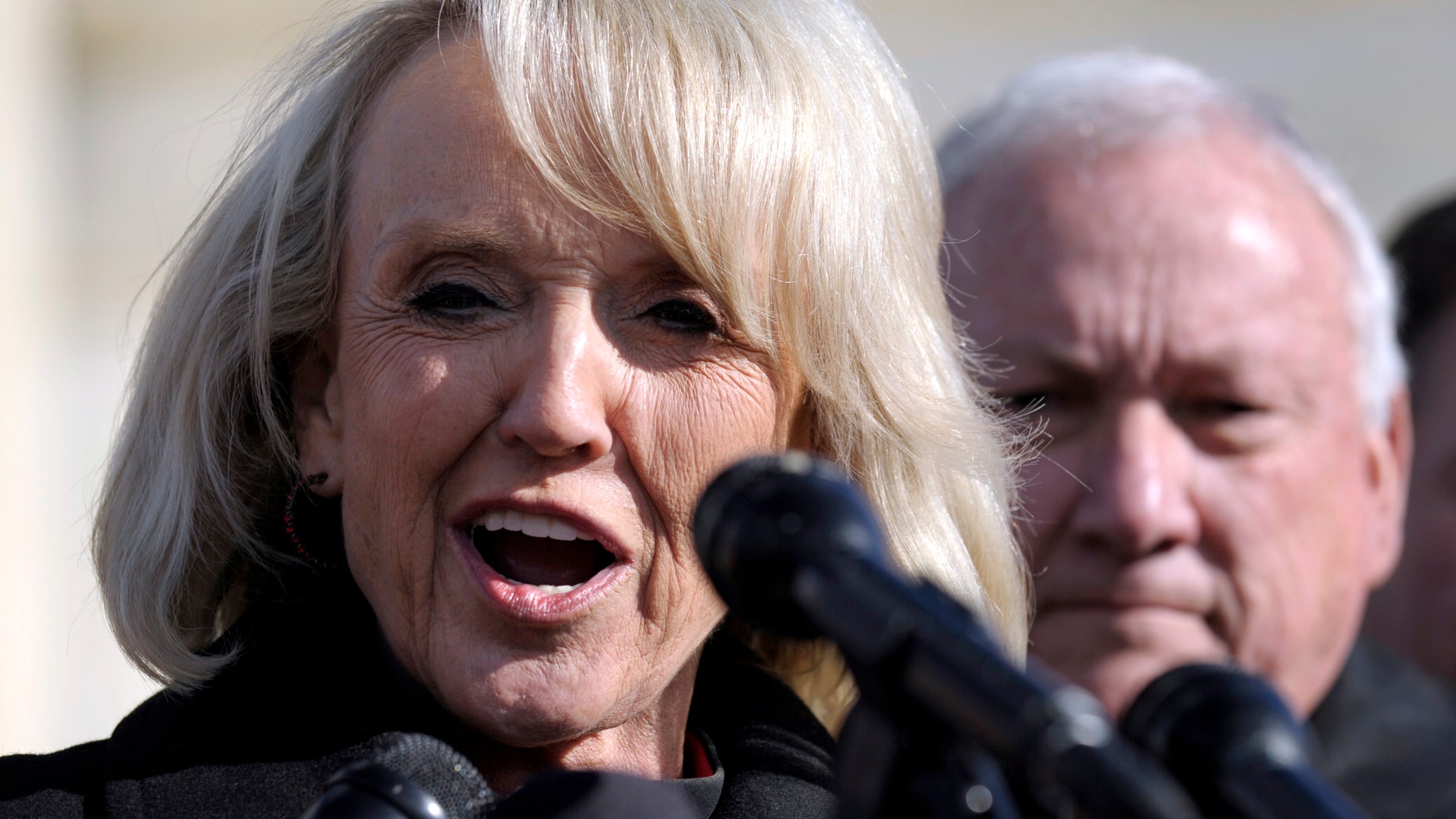 Arizona Gov. Jan Brewer speaks to reporters outside the Supreme Court in Washington, Wednesday, Dec. 8, 2010. (AP)