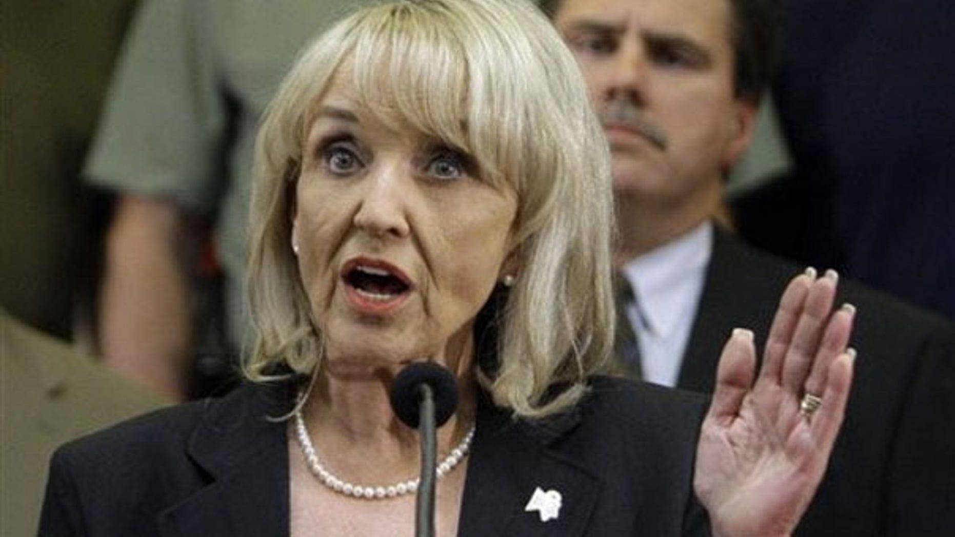 Arizona Gov. Jan Brewer is shown here discussing her state's controversial immigration bill April 23 in Phoenix. (AP Photo)