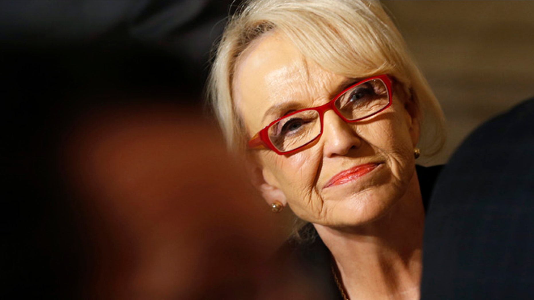 Feb. 24, 2014: Arizona Governor Jan Brewer looks up as President Obama addresses the National Governors Association in the State Dining Room of the White House in Washington. (Reuters)