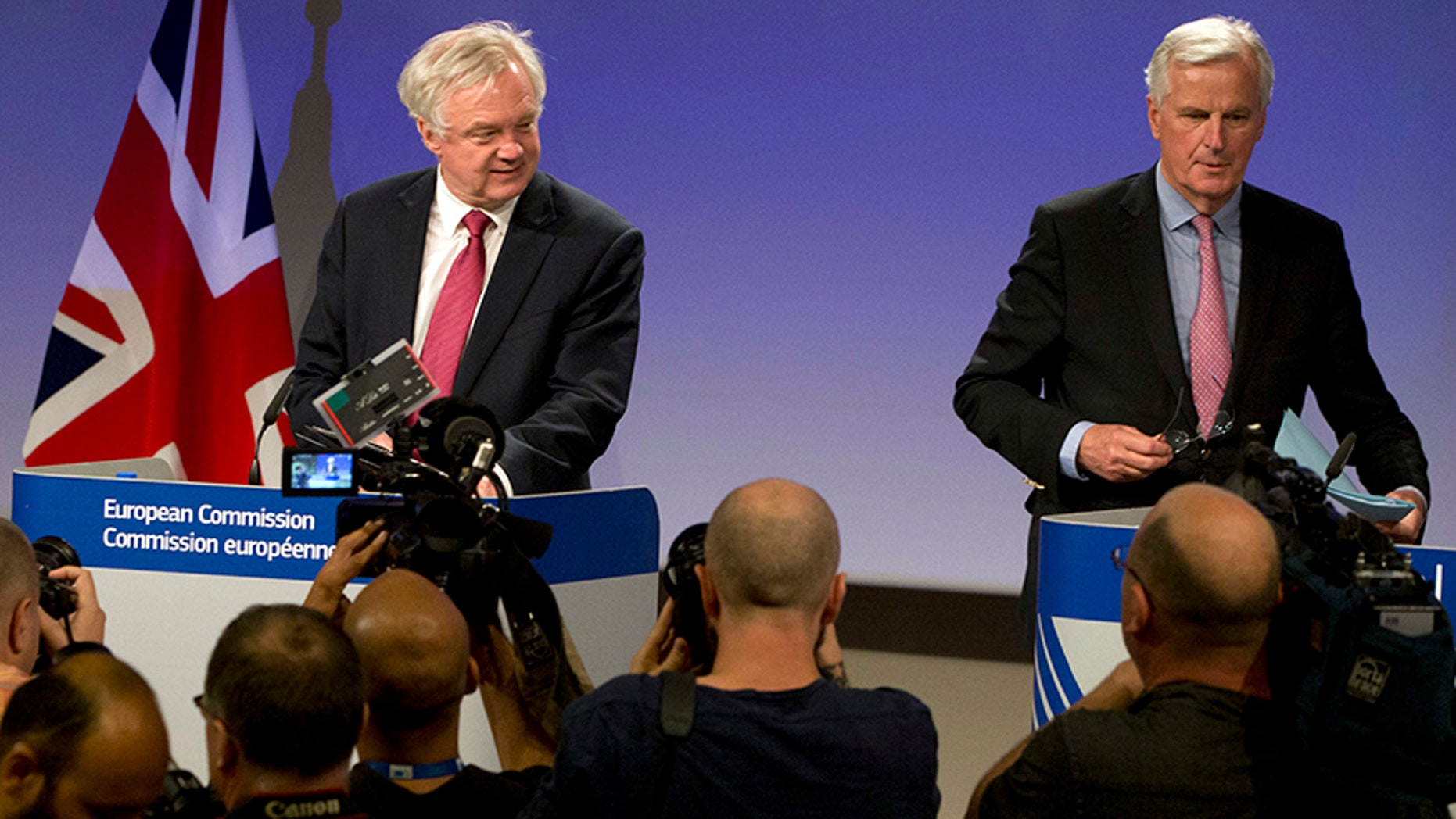 June 19, 2017: EU Chief Brexit Negotiator Michel Barnier, right, and British Secretary of State for Exiting the EU David Davis arrive for a media conference at EU headquarters in Brussels.