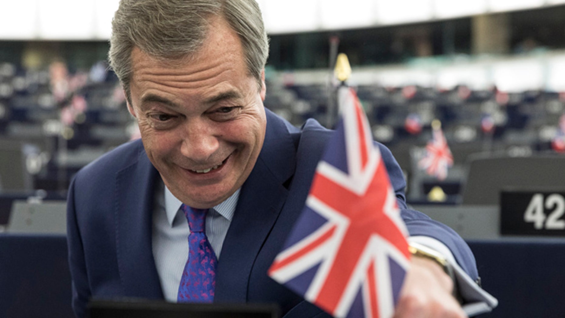 Britain's former UKIP leader Nigel Farage attends a session at the European Parliament in Strasbourg, eastern France, Wednesday, April 5, 2017. The European Union's chief negotiator in the upcoming divorce proceedings with Britain says that parallel talks on its exit from the EU and a future trade relationship "is a very risky approach" he is bent on avoiding. (AP Photo/Jean-Francois Badias)
