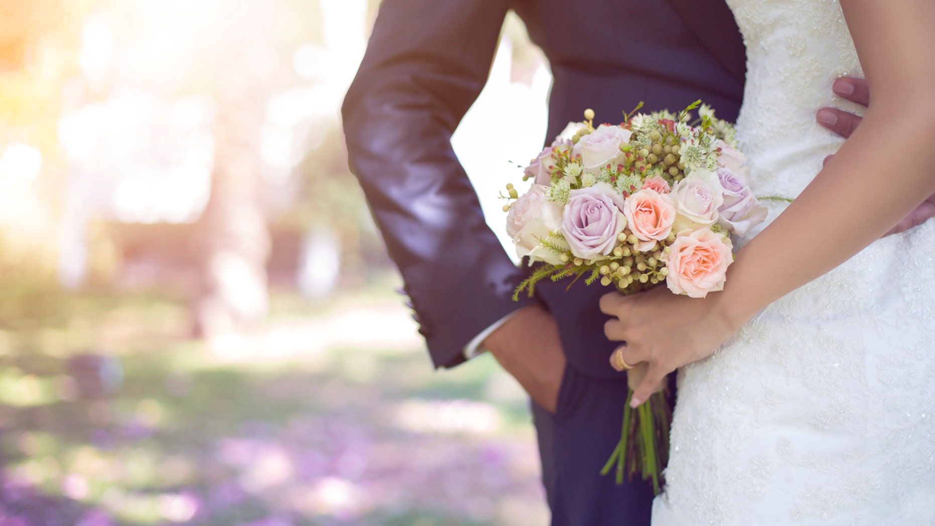 Bride holding bouquet.